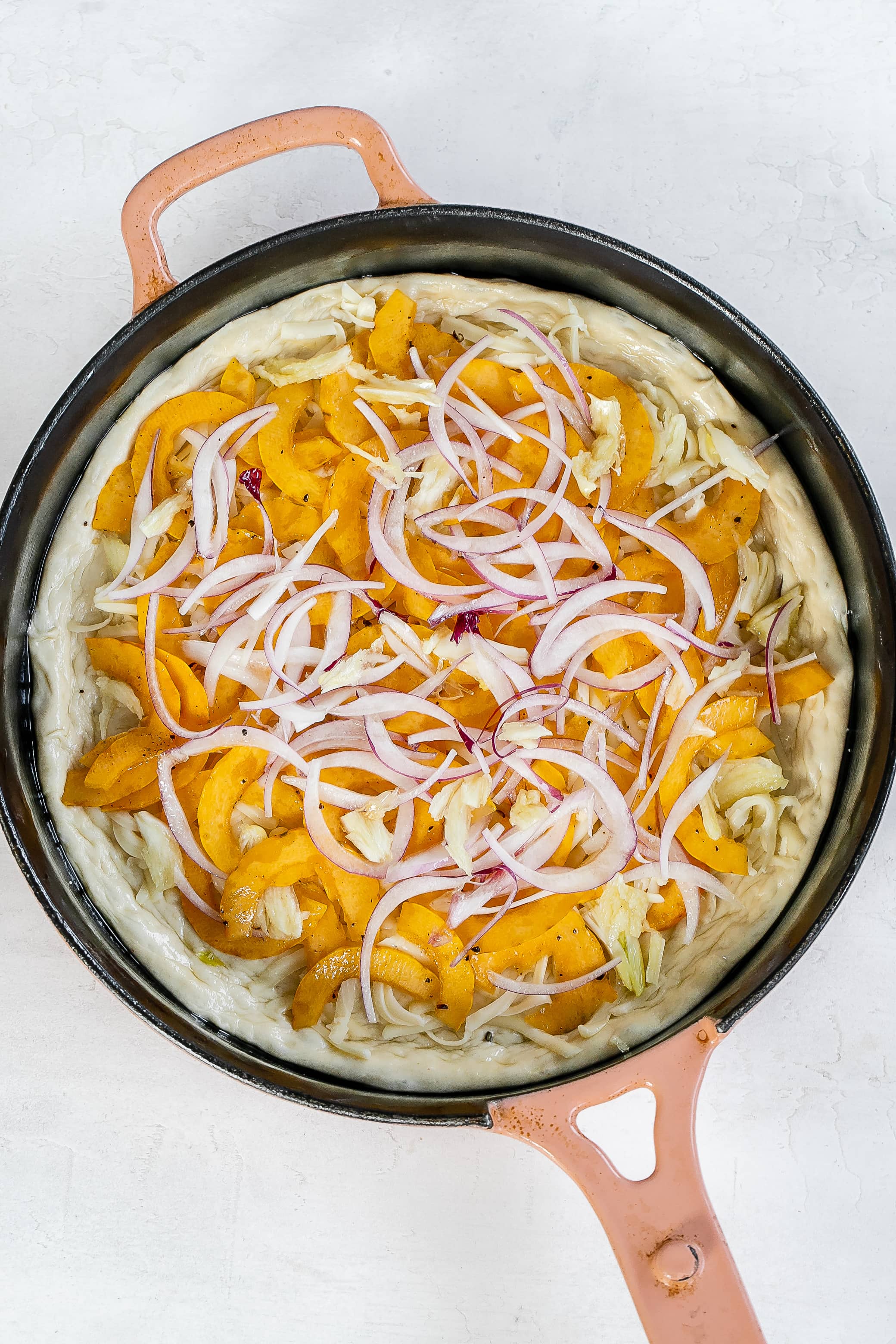 toppings on pizza dough.