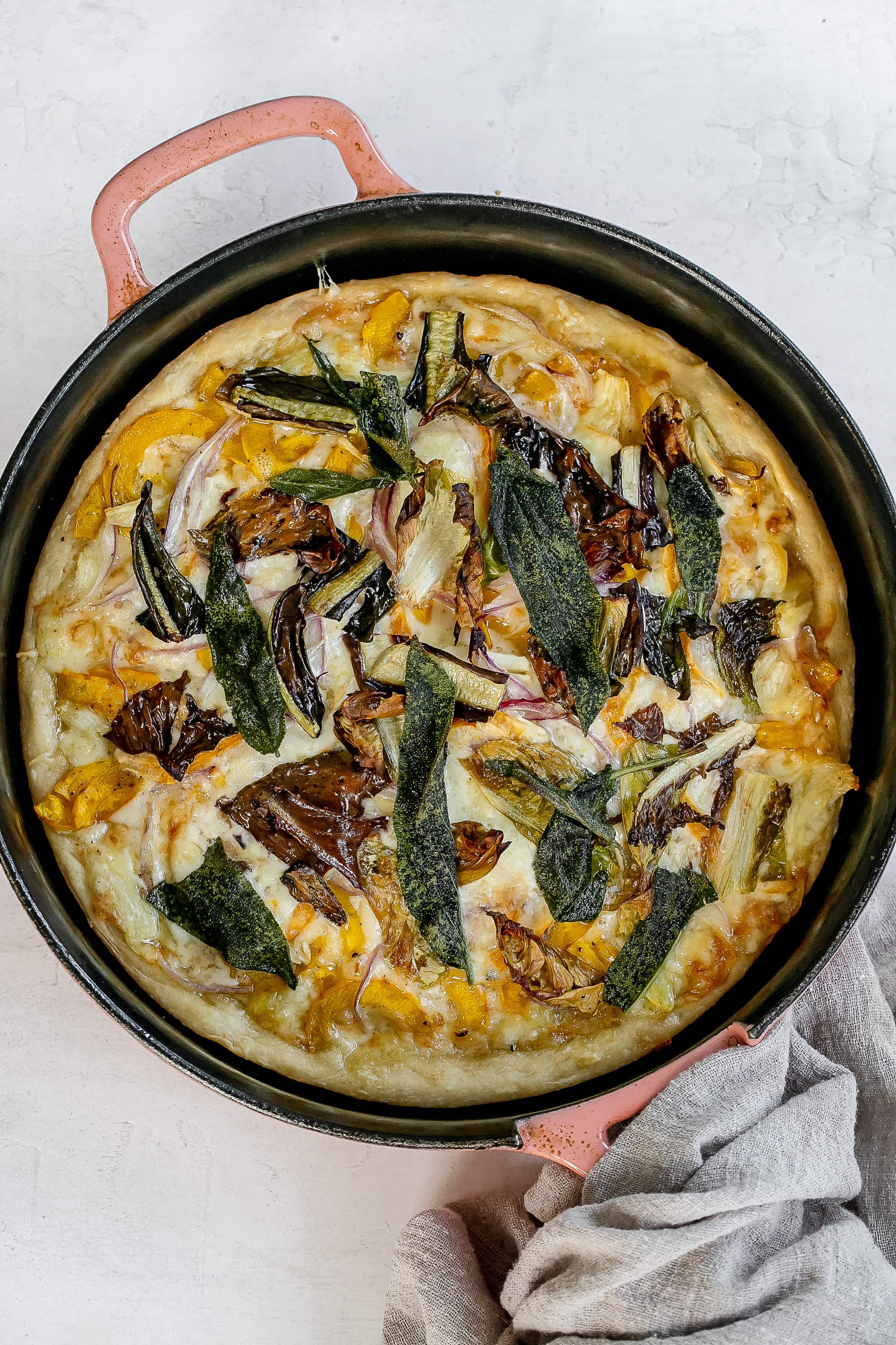 pizza cooked in cast iron skillet. 