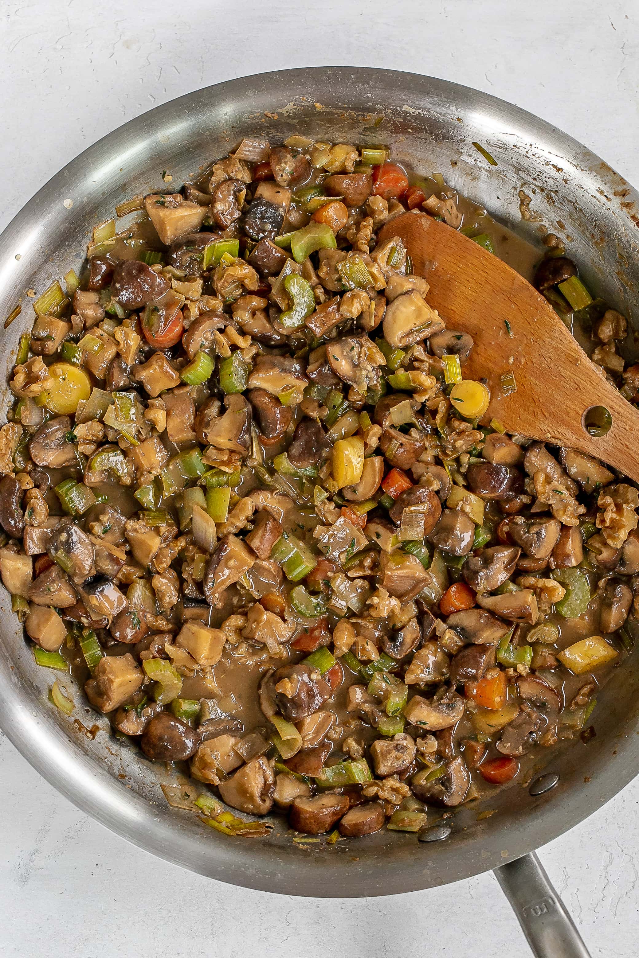 veggies in skillet with broth added.