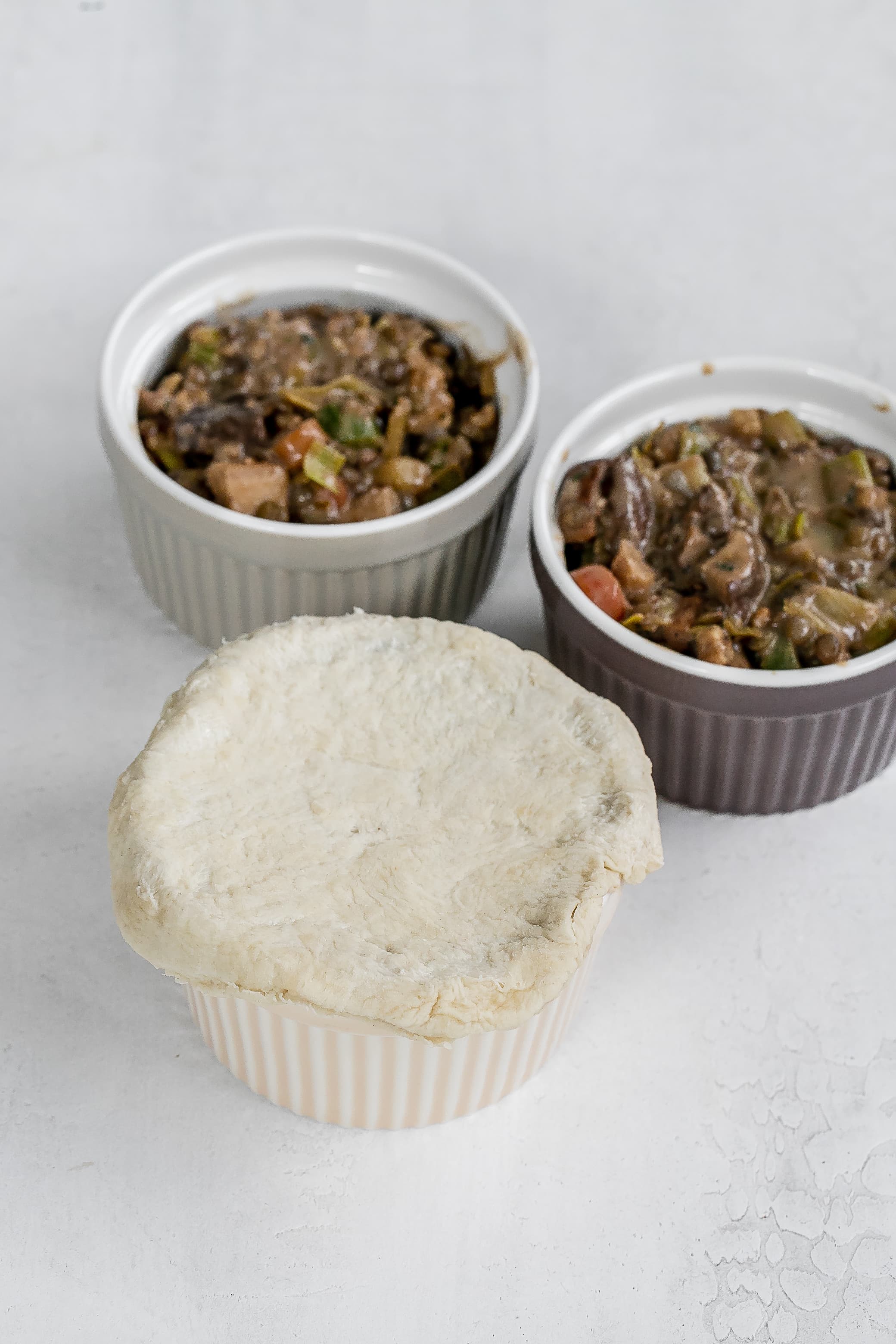 ramekin with puff pastry on top.