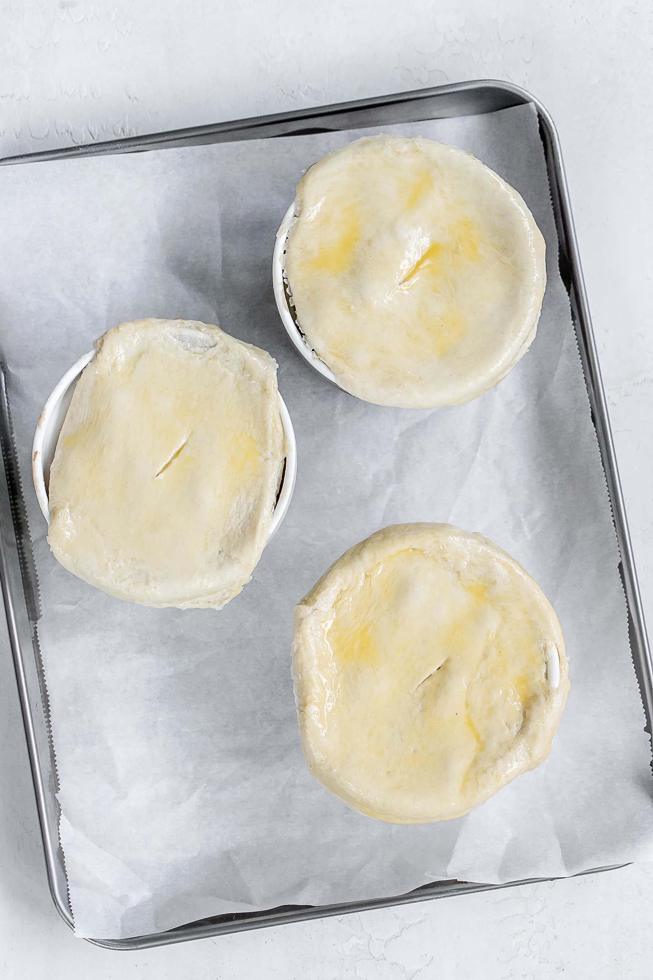 ramekins on baking sheet.