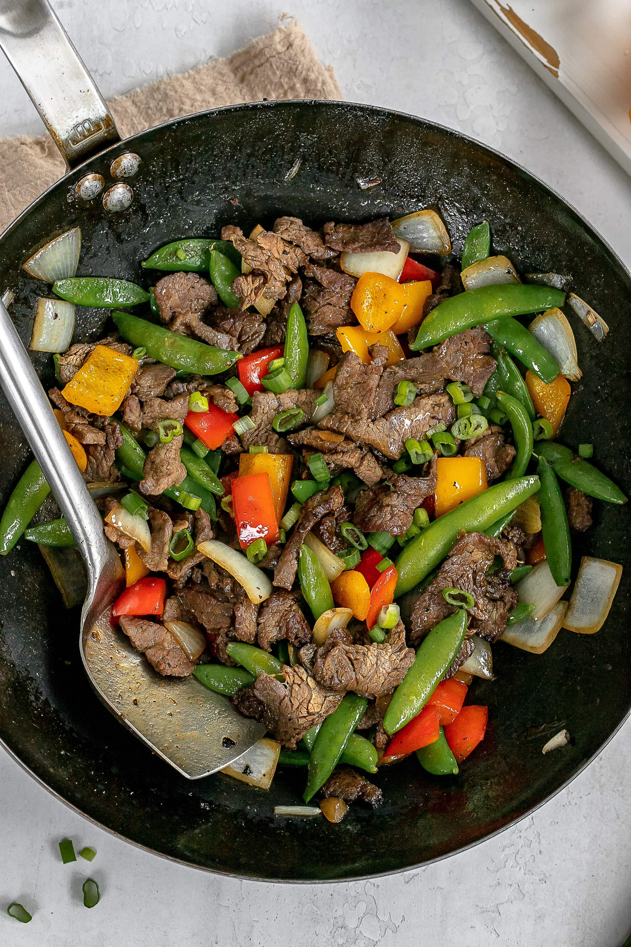 flank steak stir fry in wok.