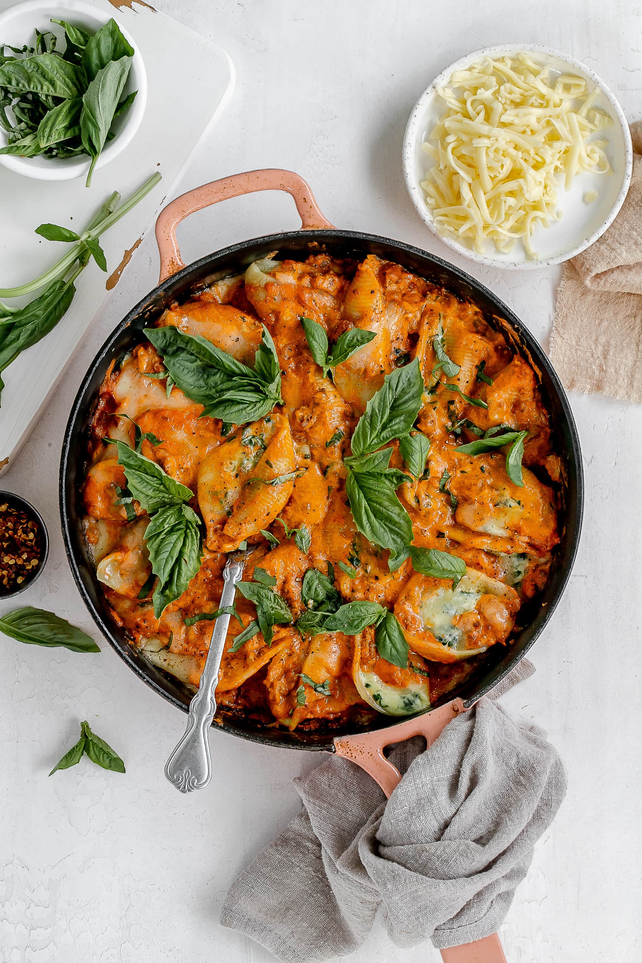 stuffed shells with vodka meat sauce in a cast iron pan.