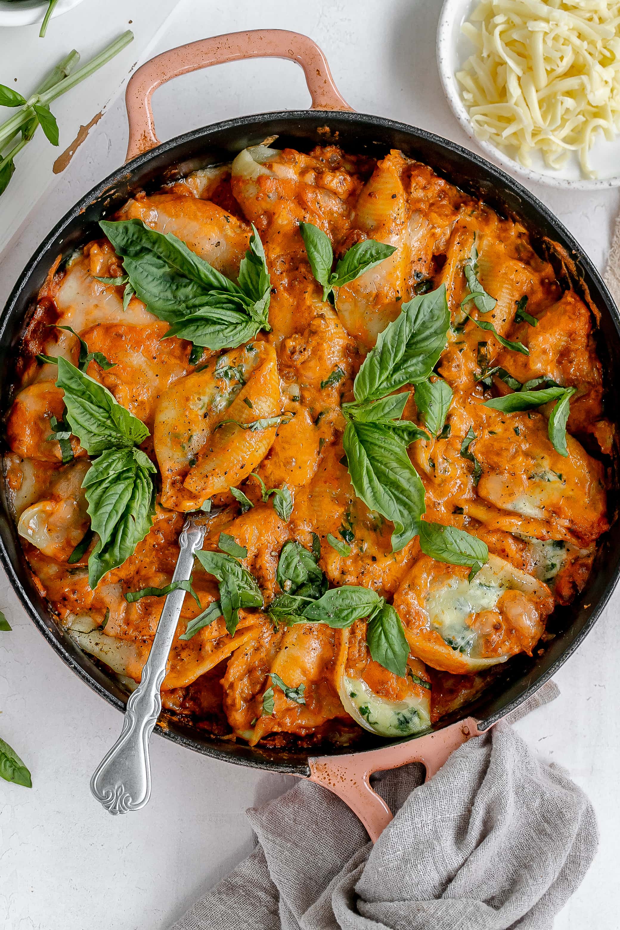 stuffed shells with vodka meat sauce in a cast iron pan.