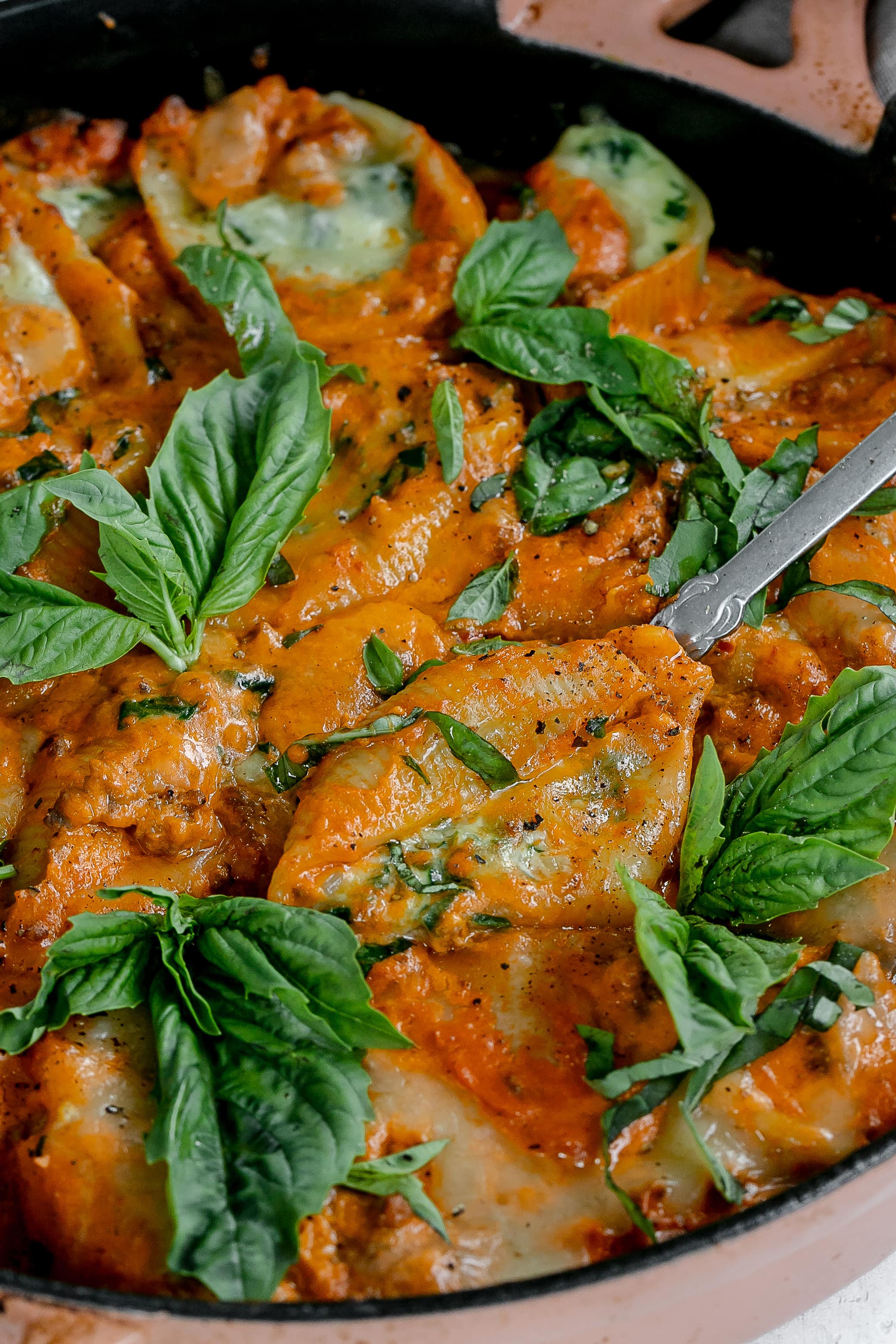 stuffed shells with vodka meat sauce in a cast iron pan.