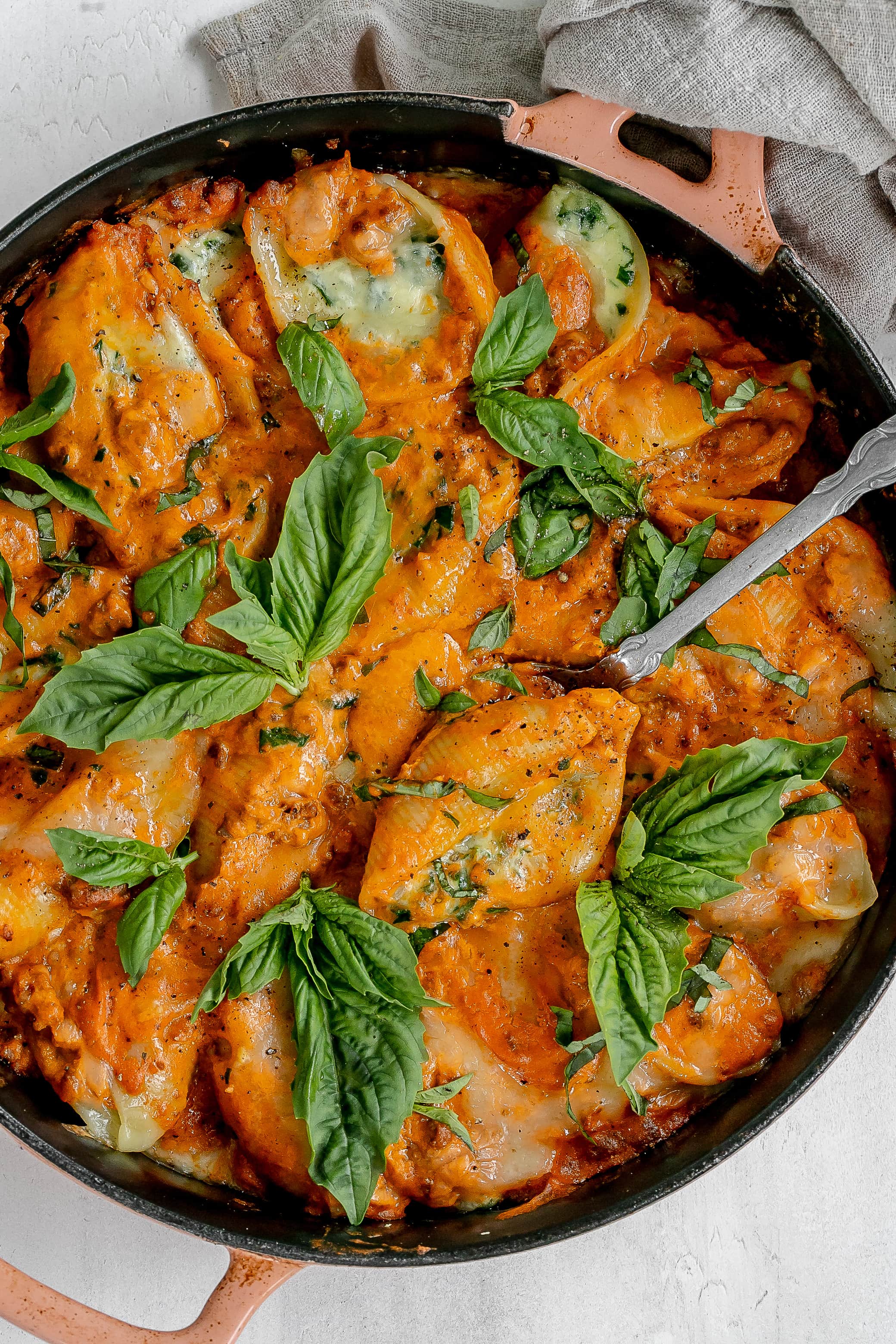 stuffed shells with vodka meat sauce in a cast iron pan.