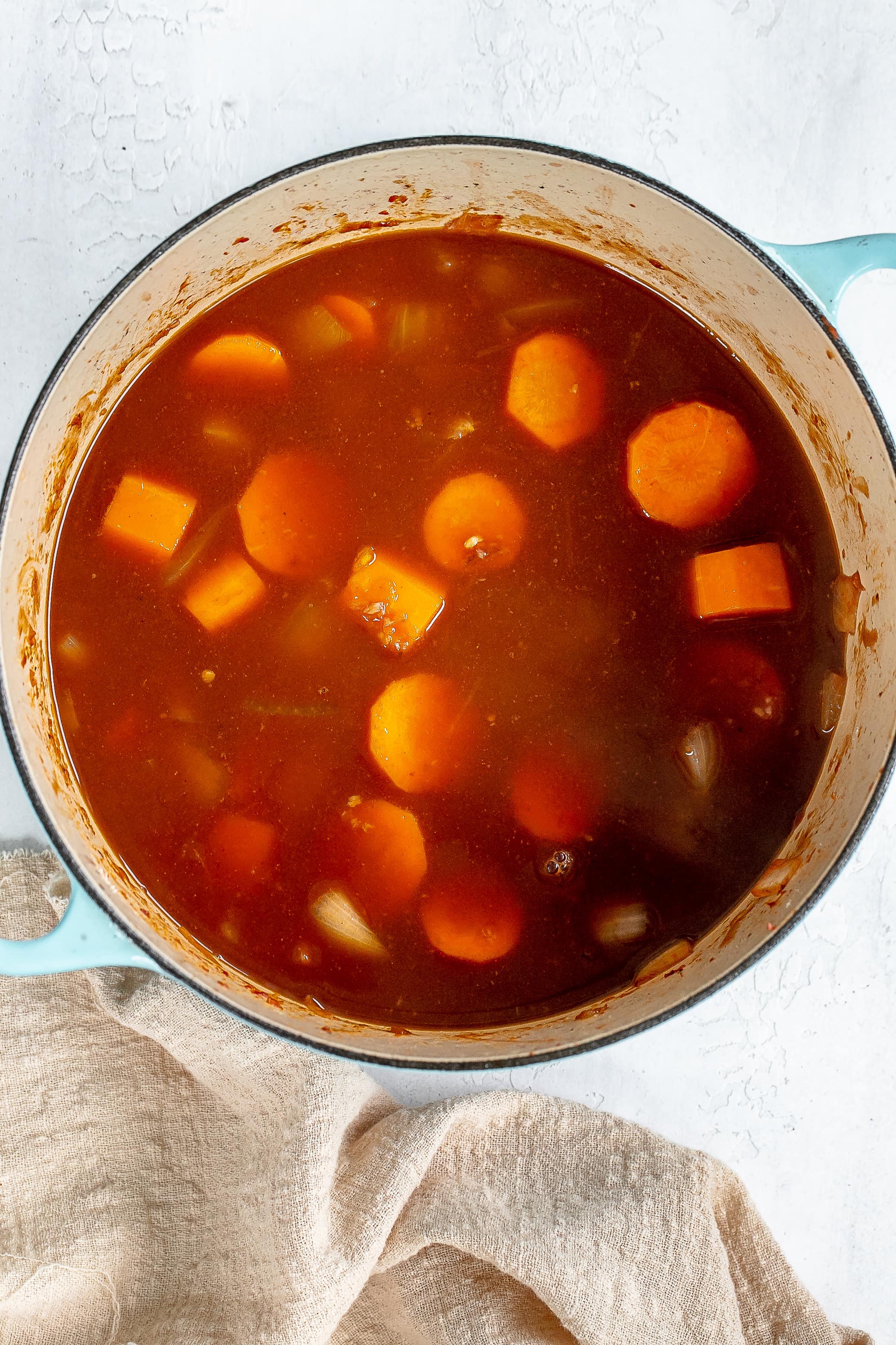 wine and broth added to dutch oven.