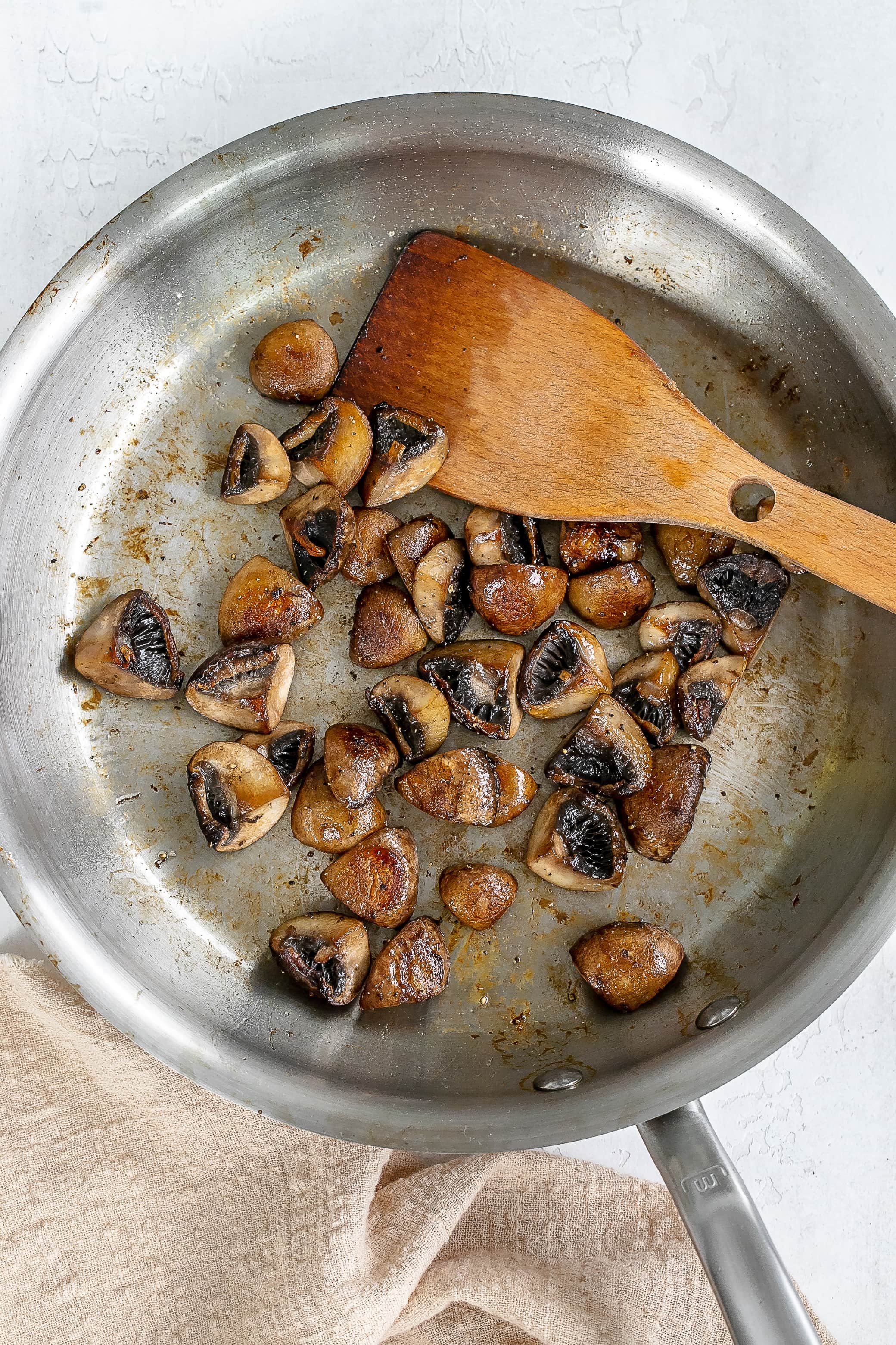mushrooms browned in skillet.