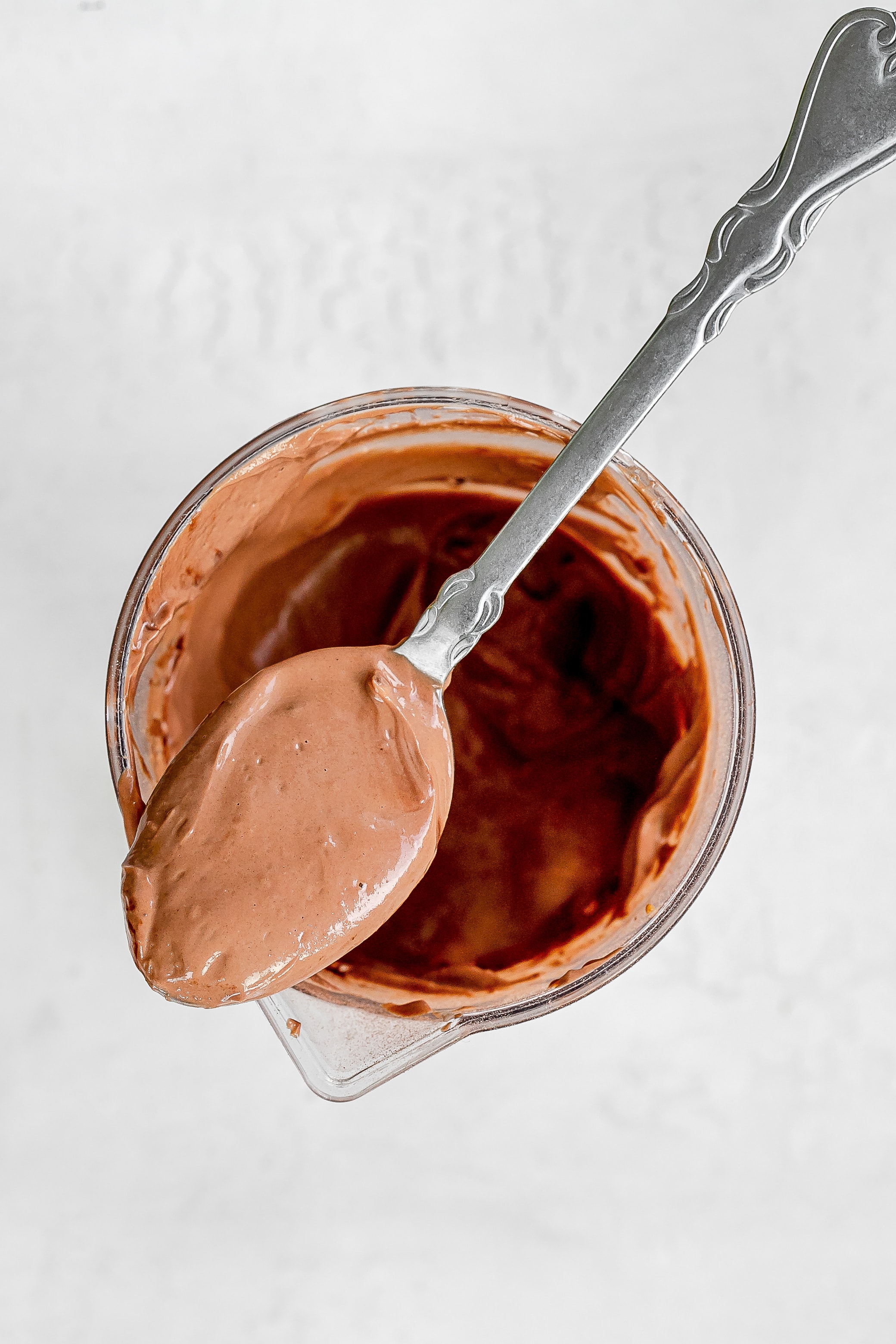 blended ingredients in jar with spoon.