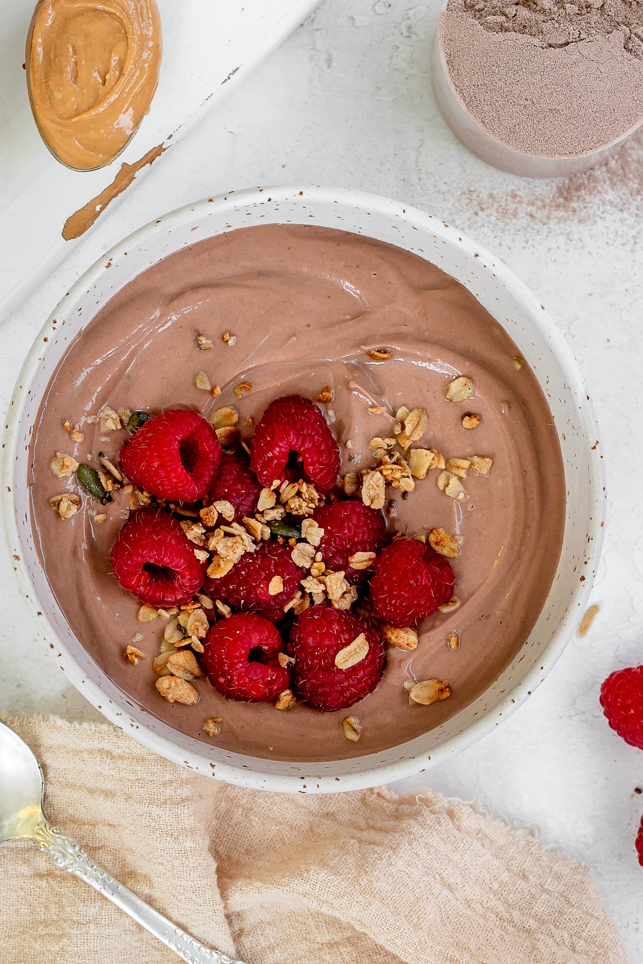 greek yogurt with protein powder in a bowl with berries.