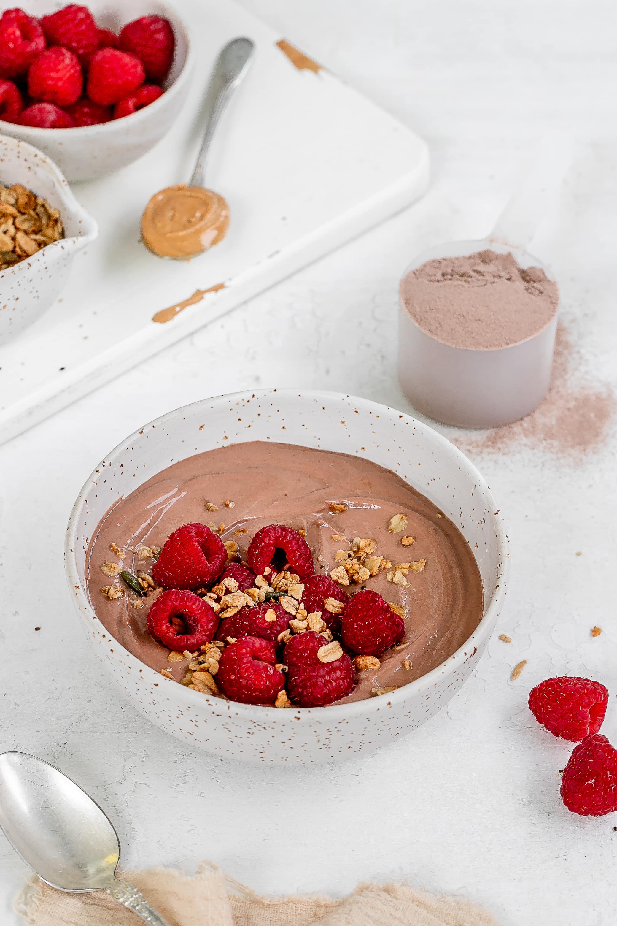 greek yogurt with protein powder in a bowl with berries.