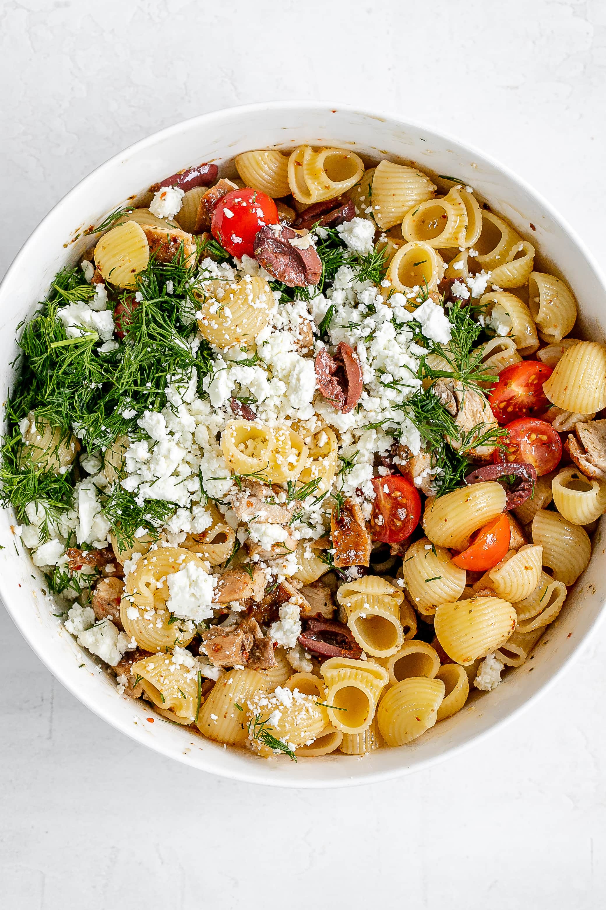 greek chicken pasta salad in a large bowl.