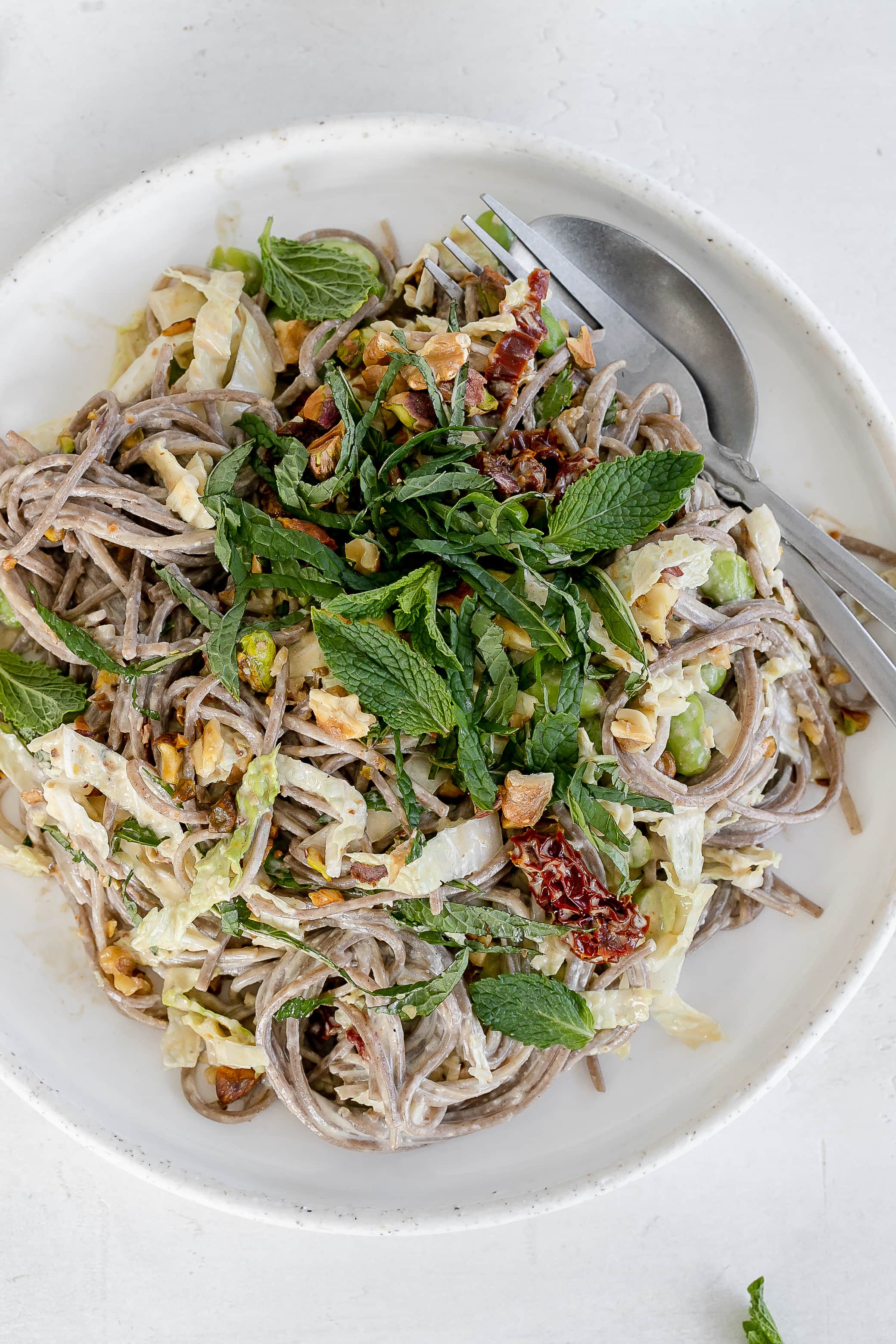 vegan soba noodle salad with sesame dressing on a plate. 
