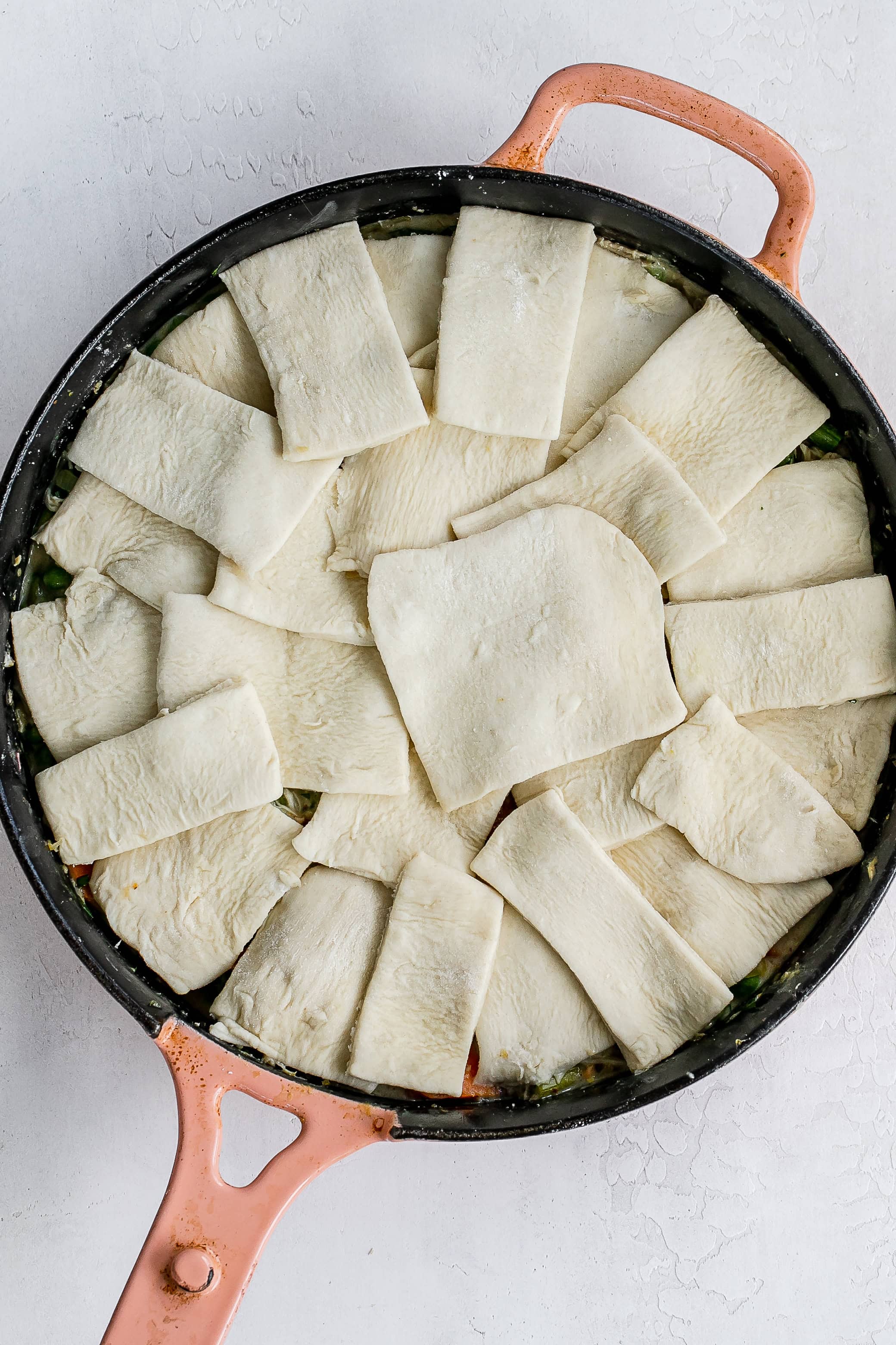 puff pastry squares added on top of chicken filling. 