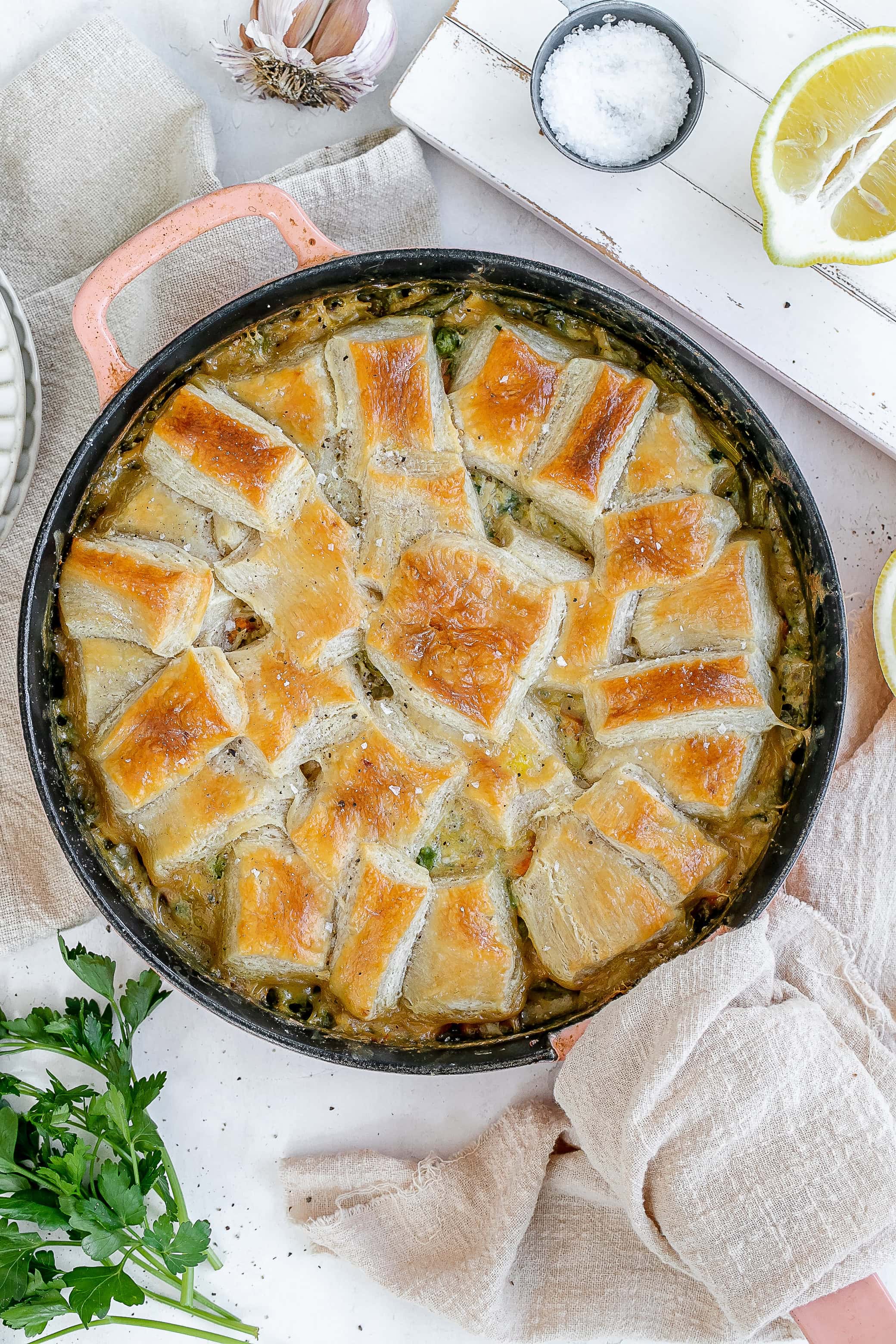 cast iron spring chicken pot pie with puff pastry.