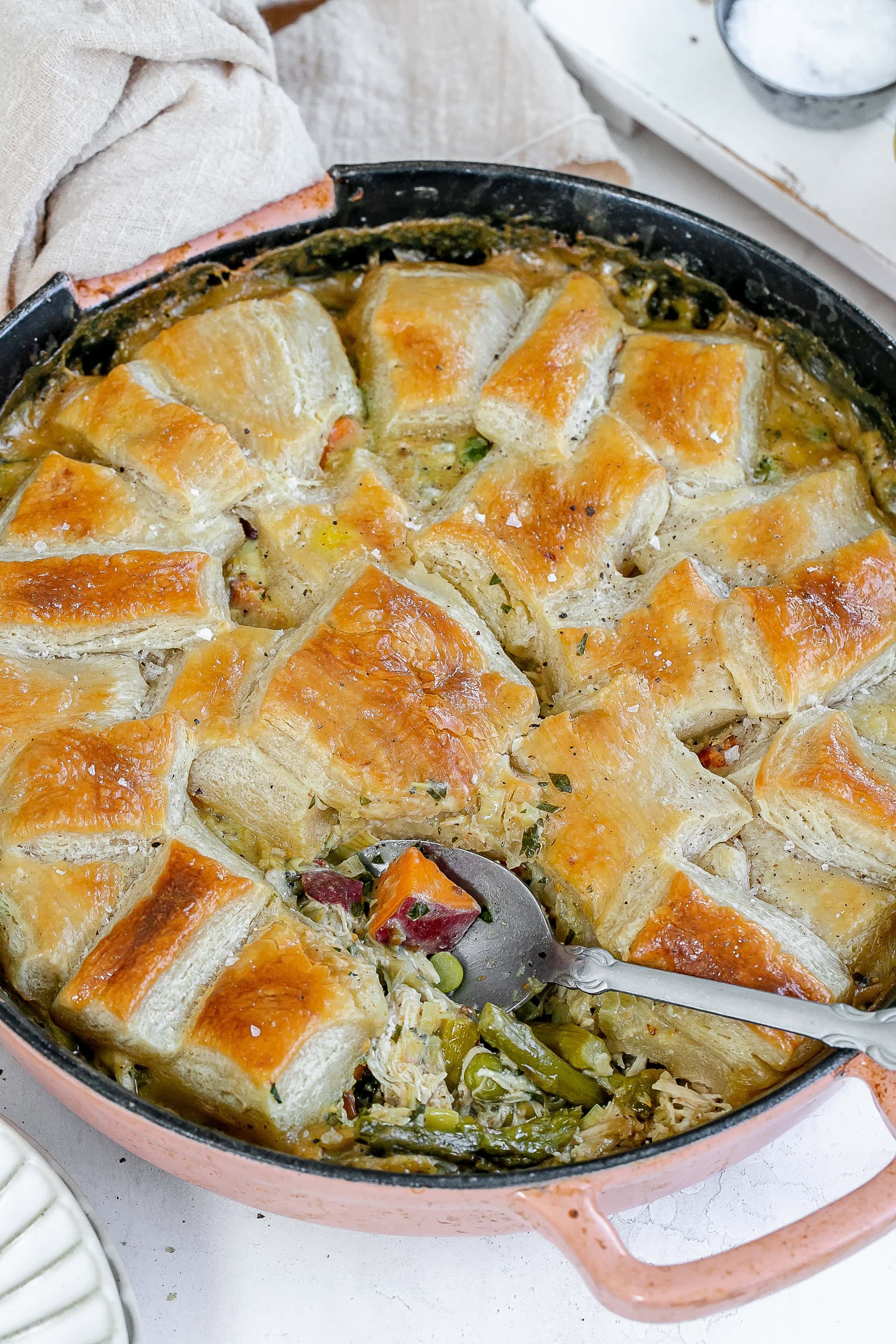 cast iron chicken pot pie with piece missing. 