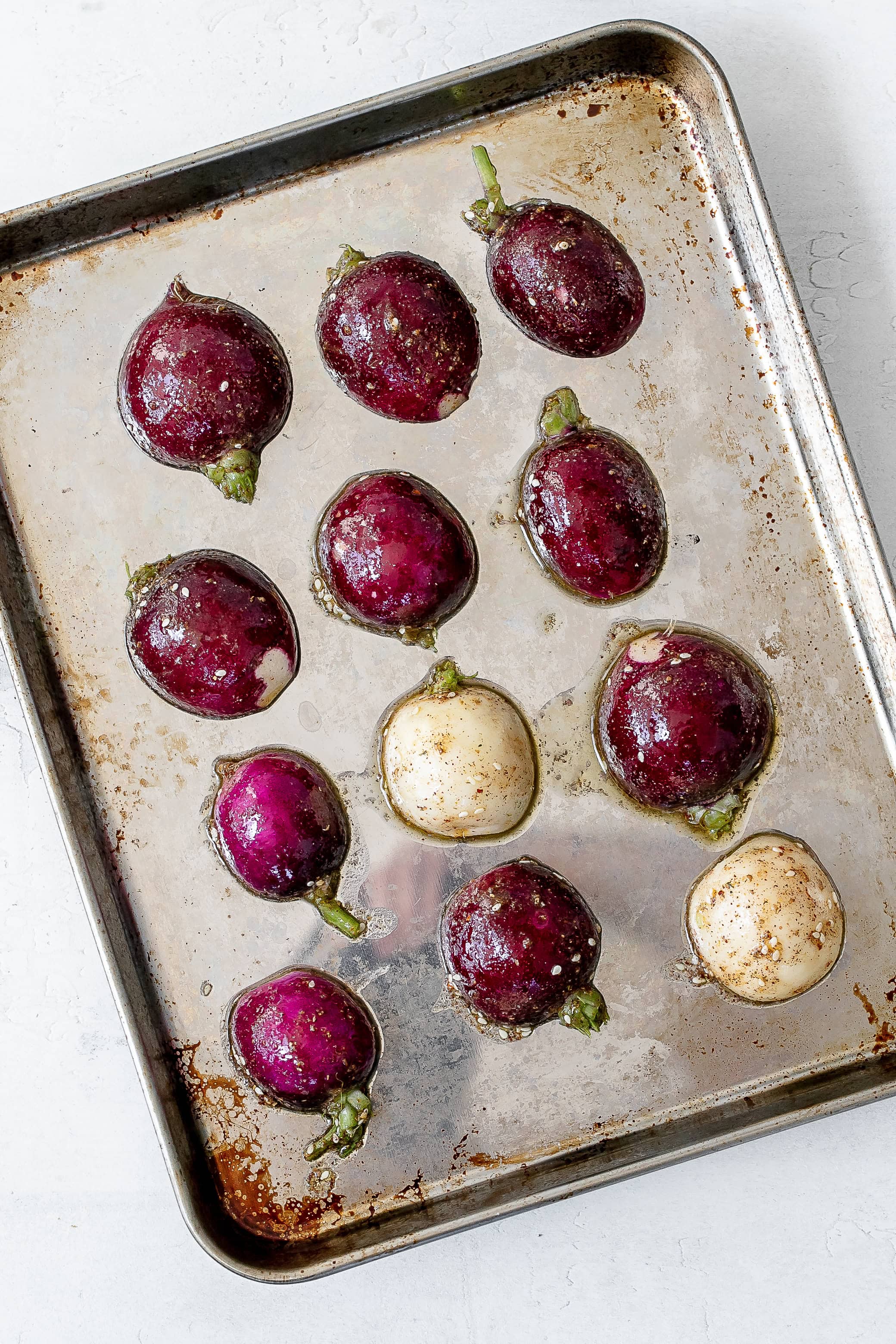 radishes on baking sheet cut side down. 