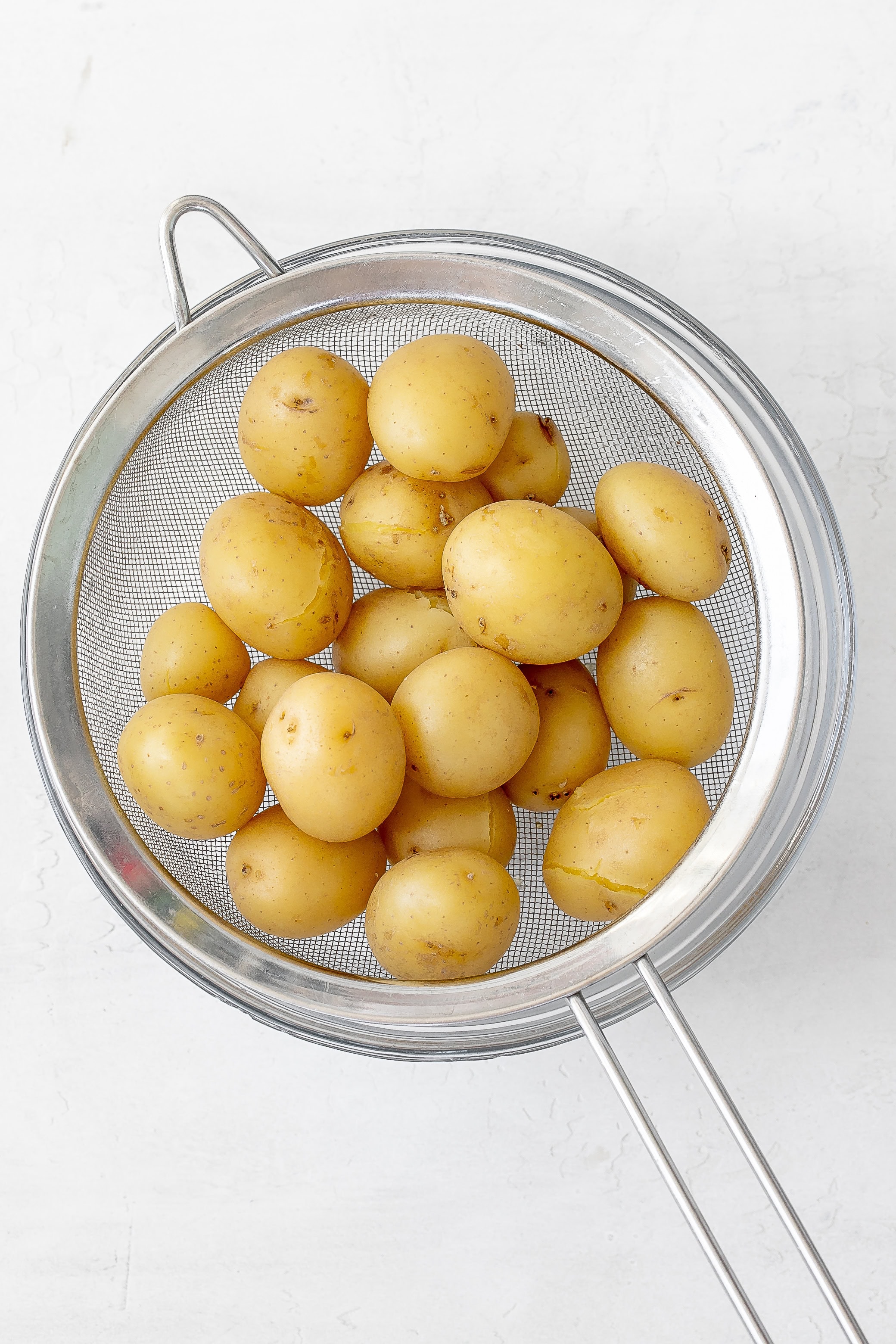 potatoes in sieve cooling. 