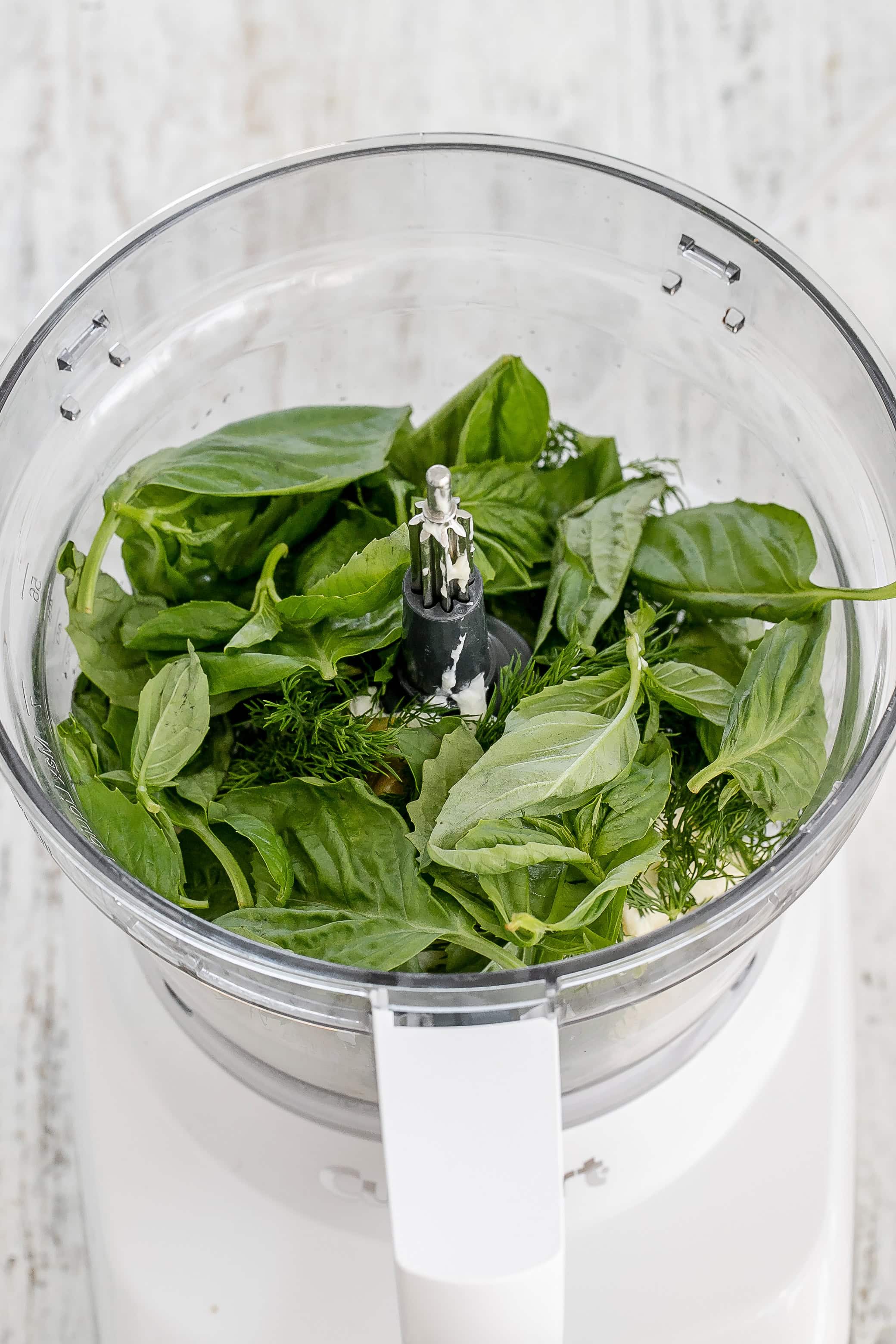ingredients for green goddess dressing in food processor..