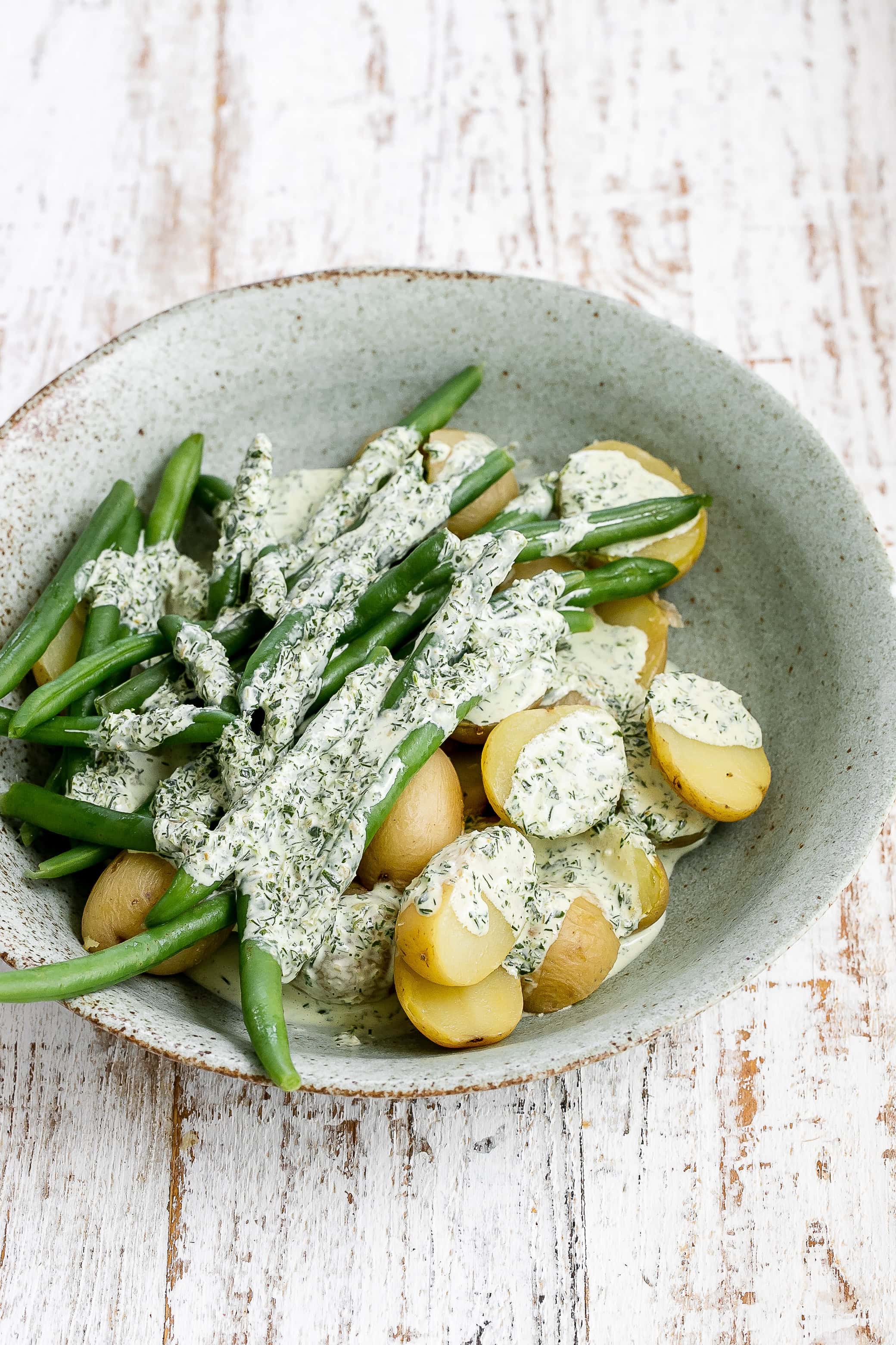 potatoes and green beans tossed in dressing.