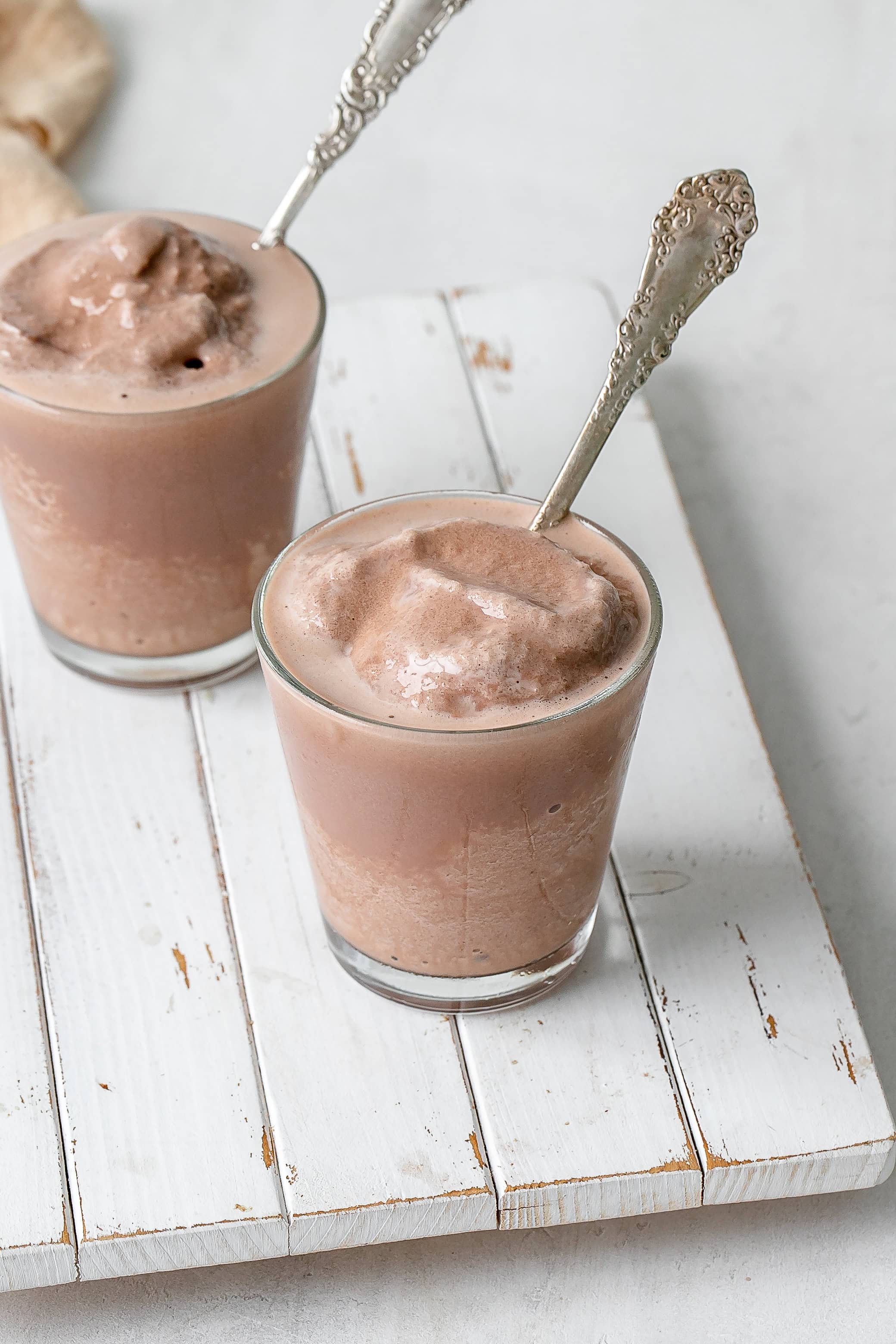 Ninja Creami frosty in a glass with a spoon.