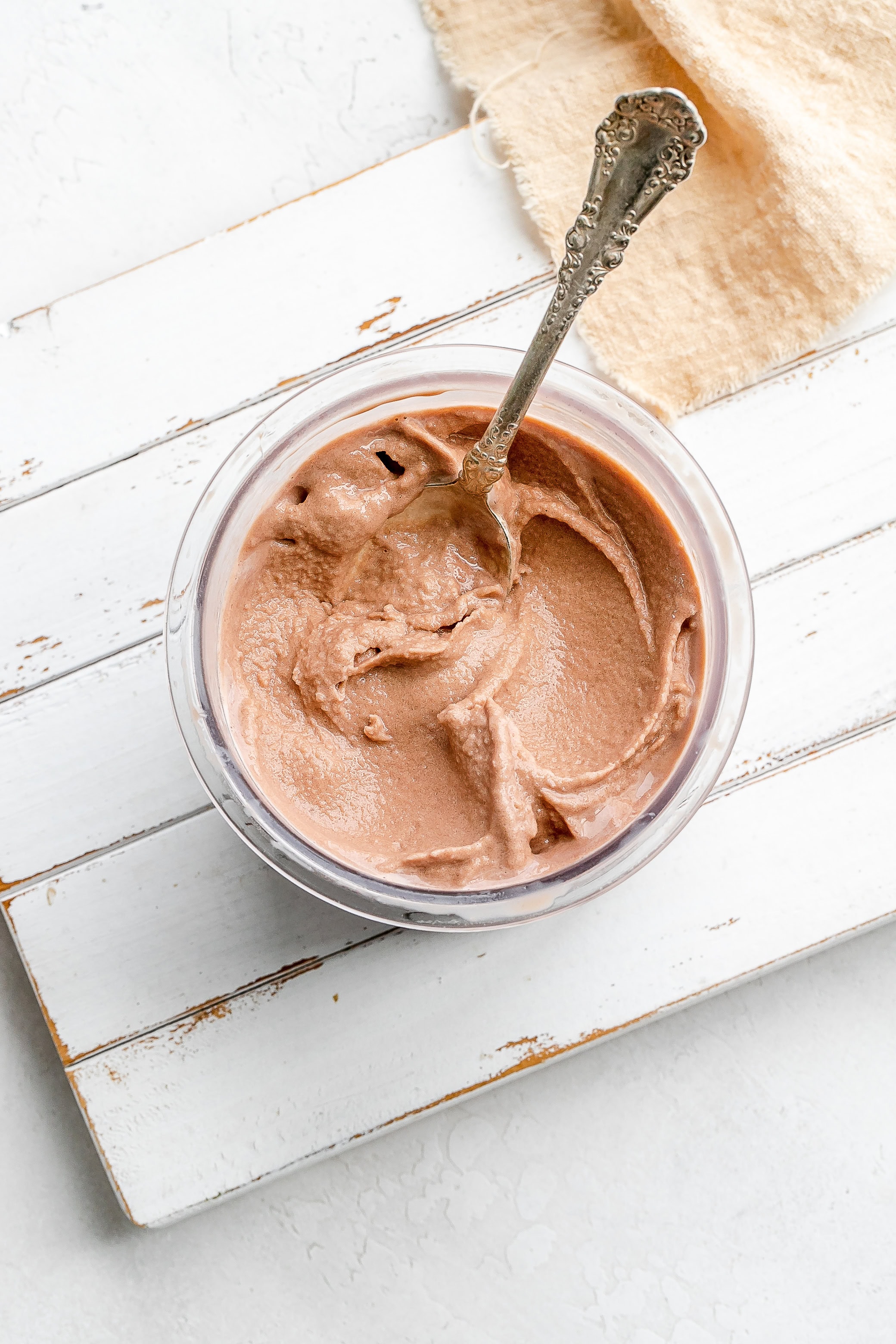 Ninja Creami frosty in container with spoon. 