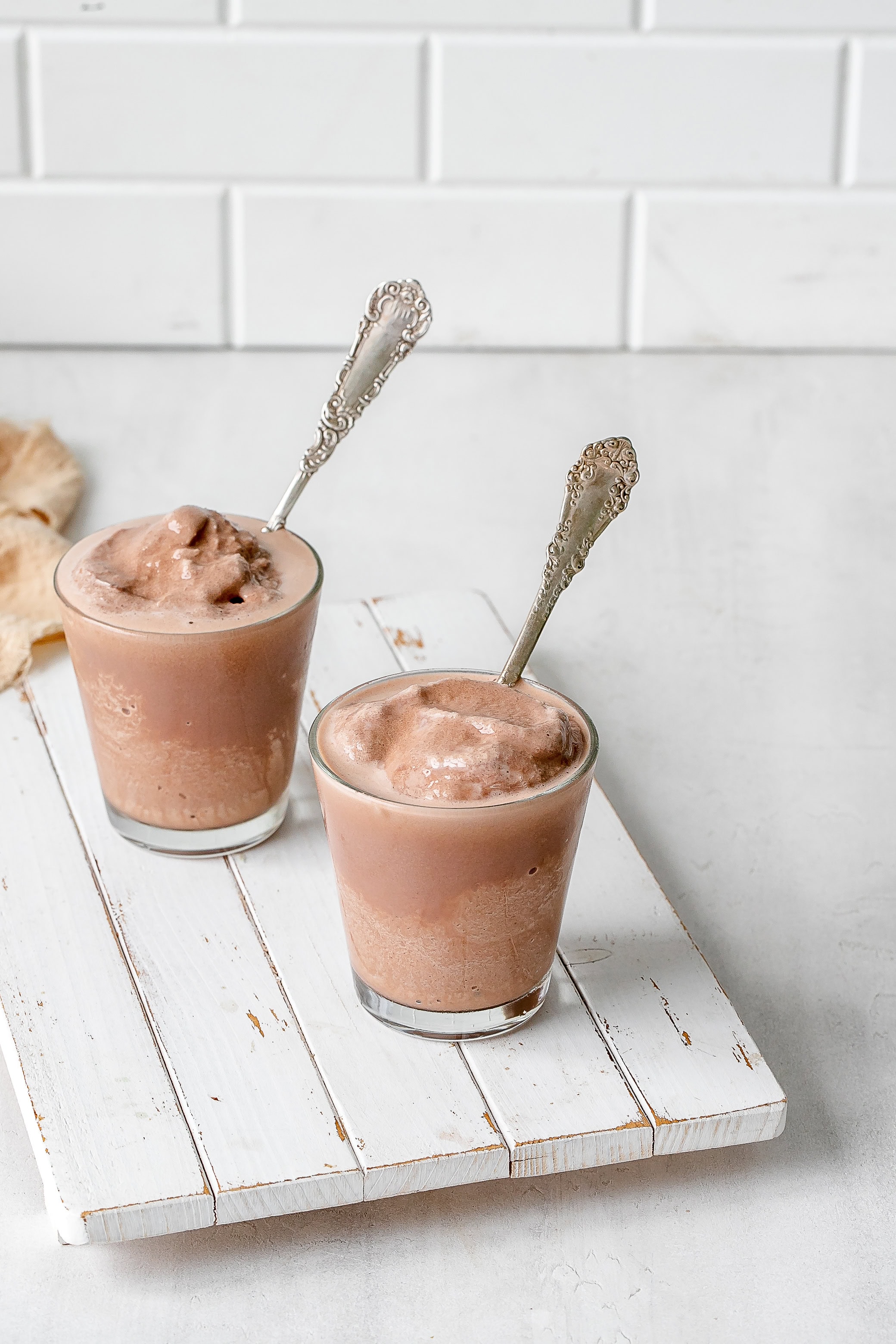 Ninja Creami frosty in a glass with a spoon.