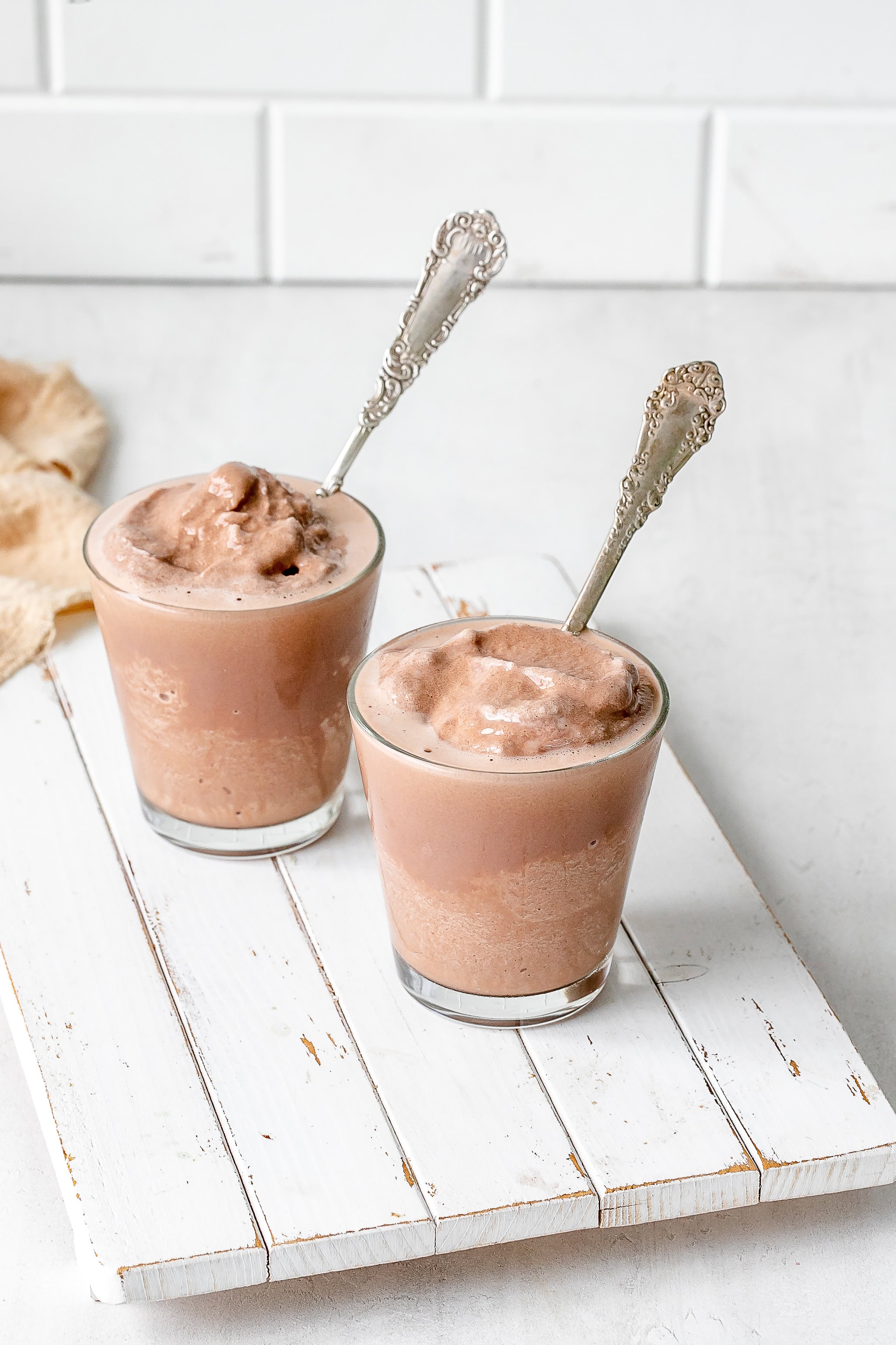 Ninja Creami frosty in a glass with a spoon.