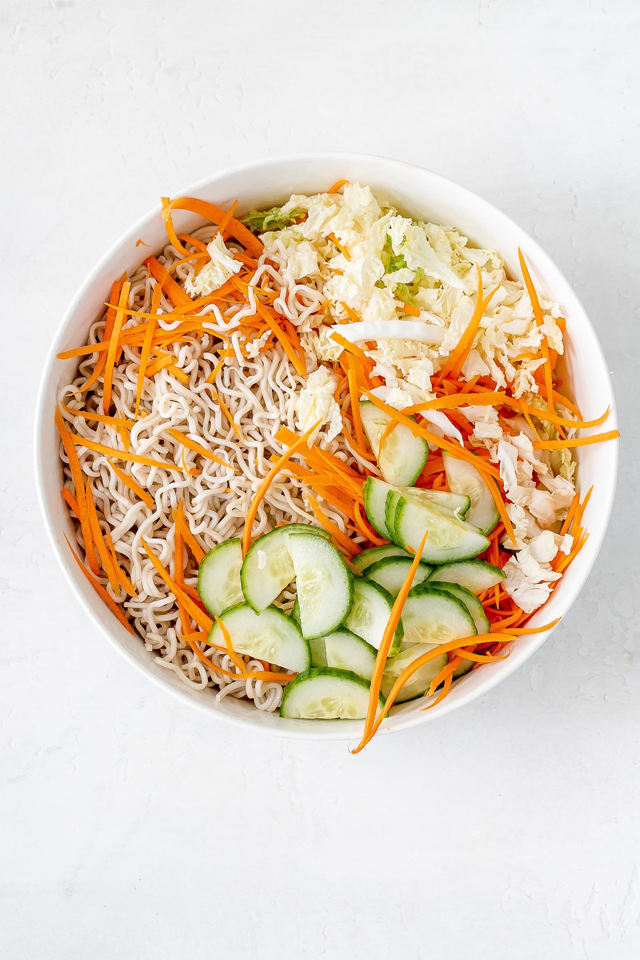 ramen noodle salad in bowl without dressing.