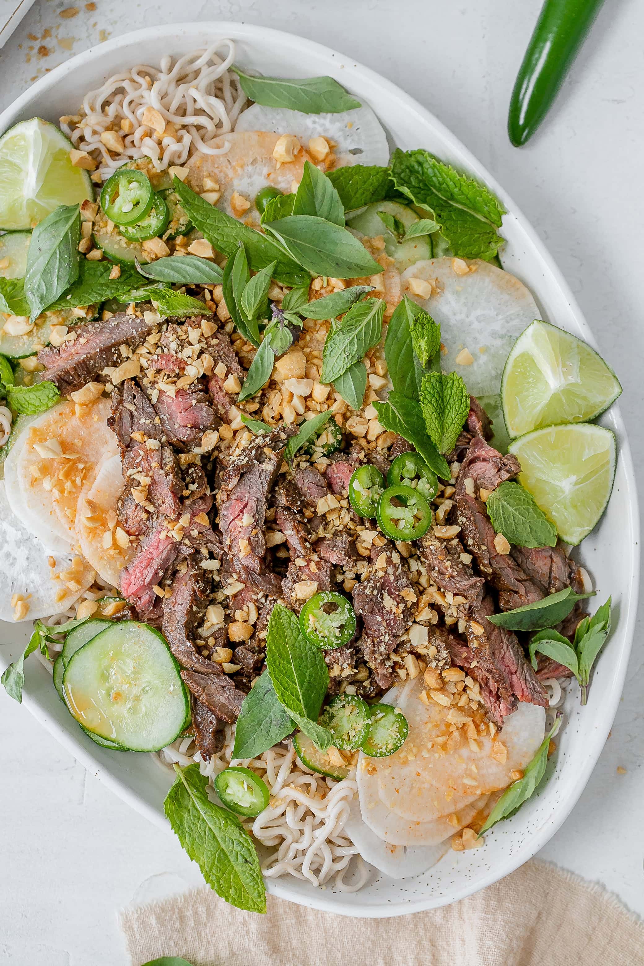Thai beef noodle salad on a platter.
