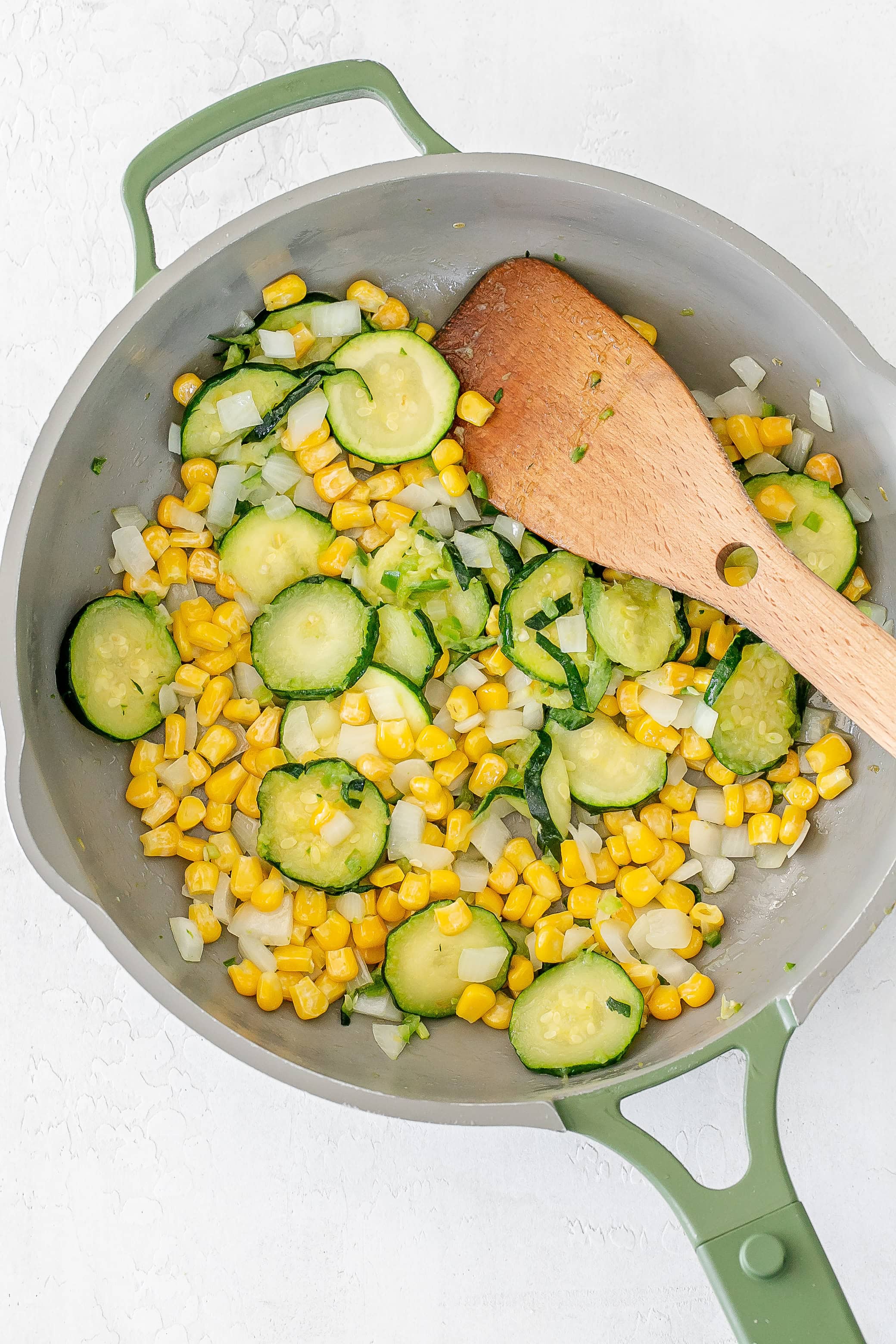corn added to skillet with zucchini.