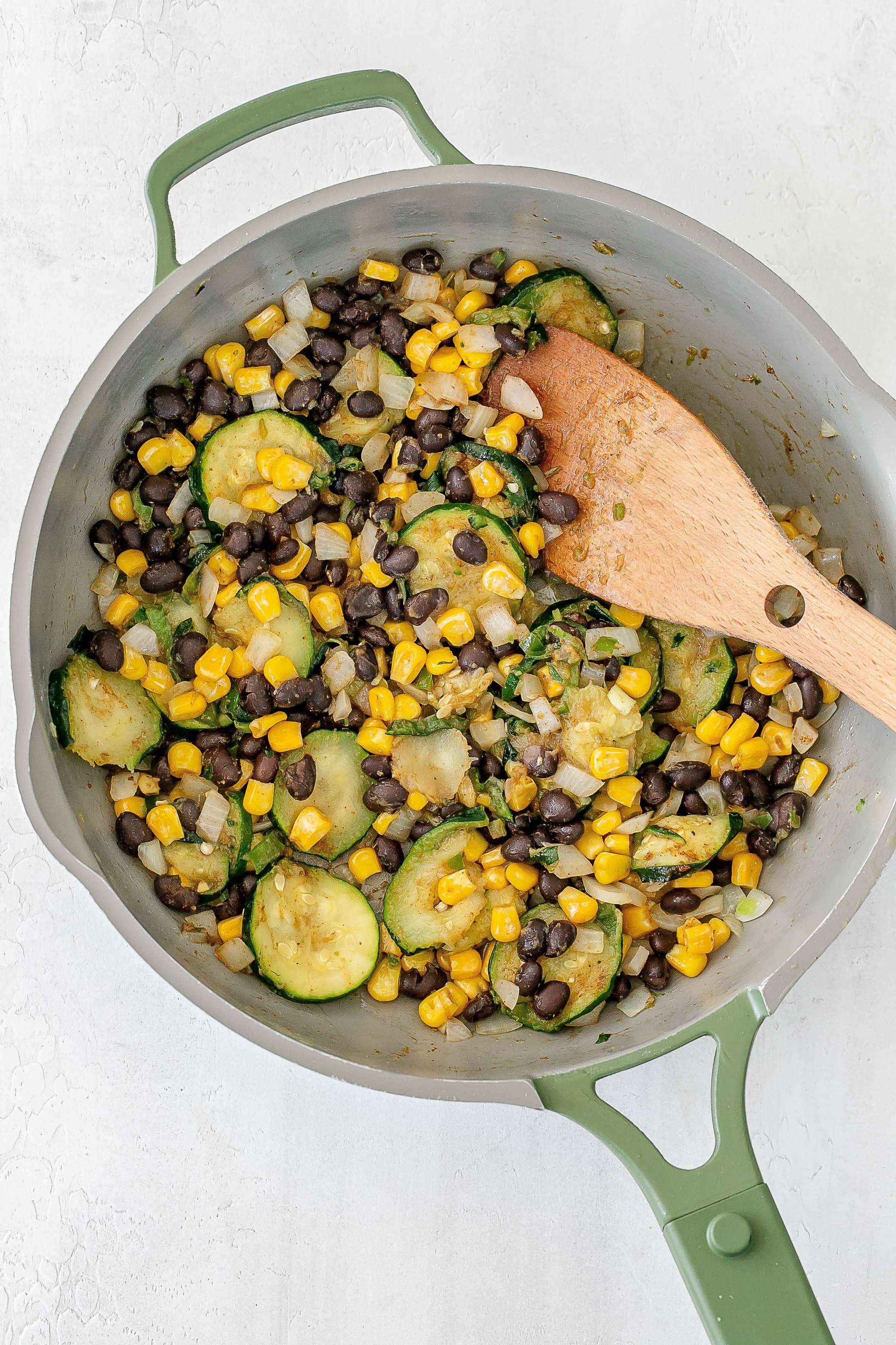 black beans added to skillet. 