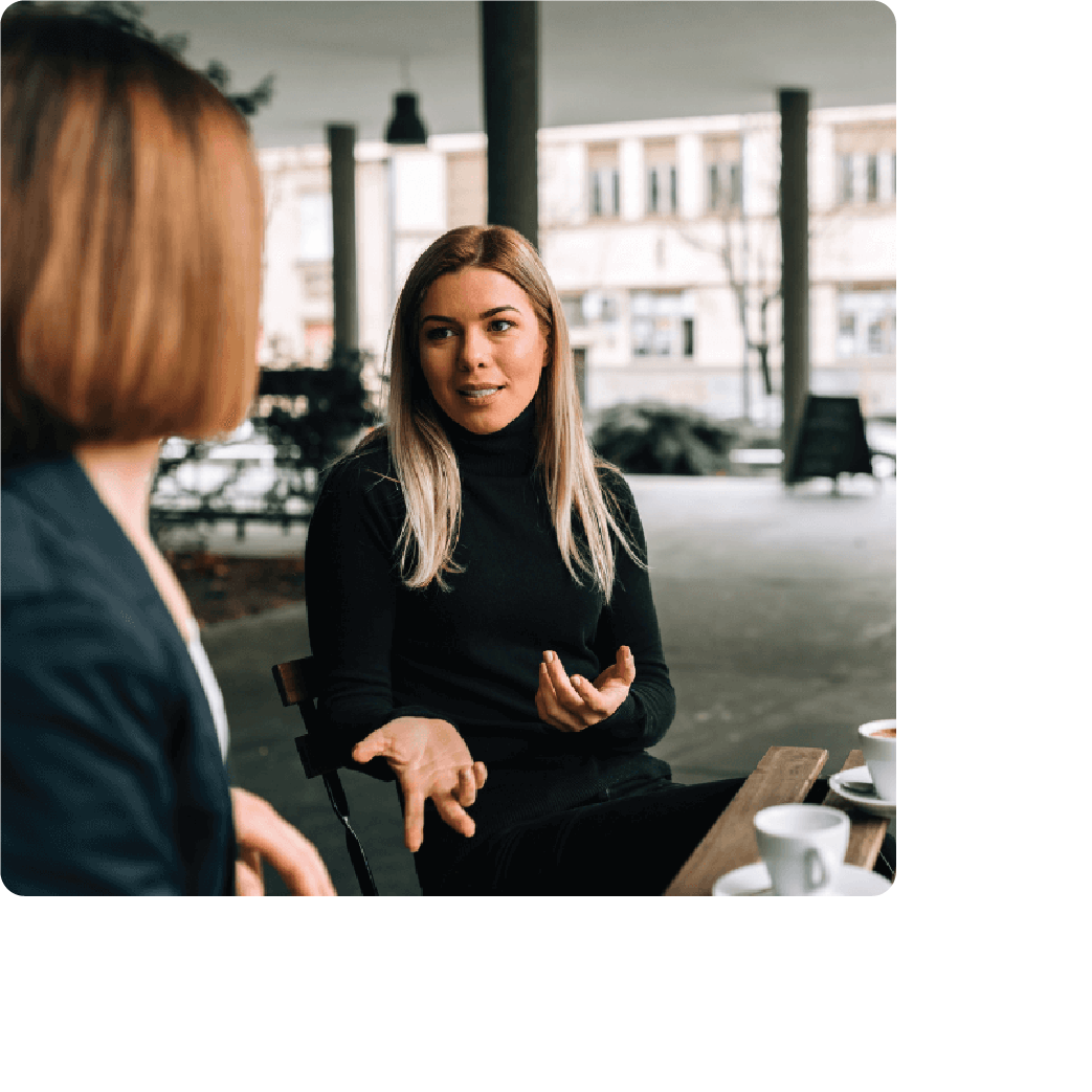 a woman explaining her business to another woman