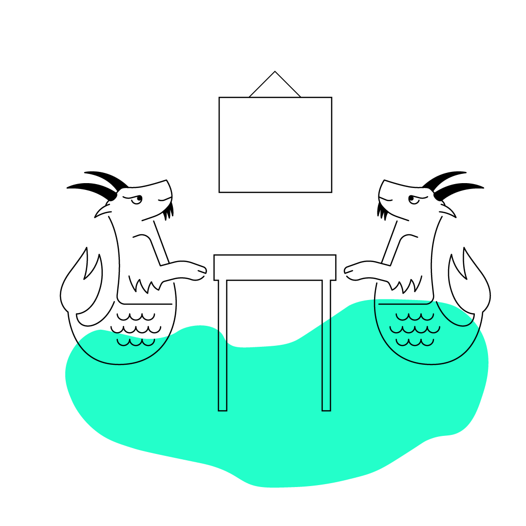 Ziegenfisch sitzt am Tisch