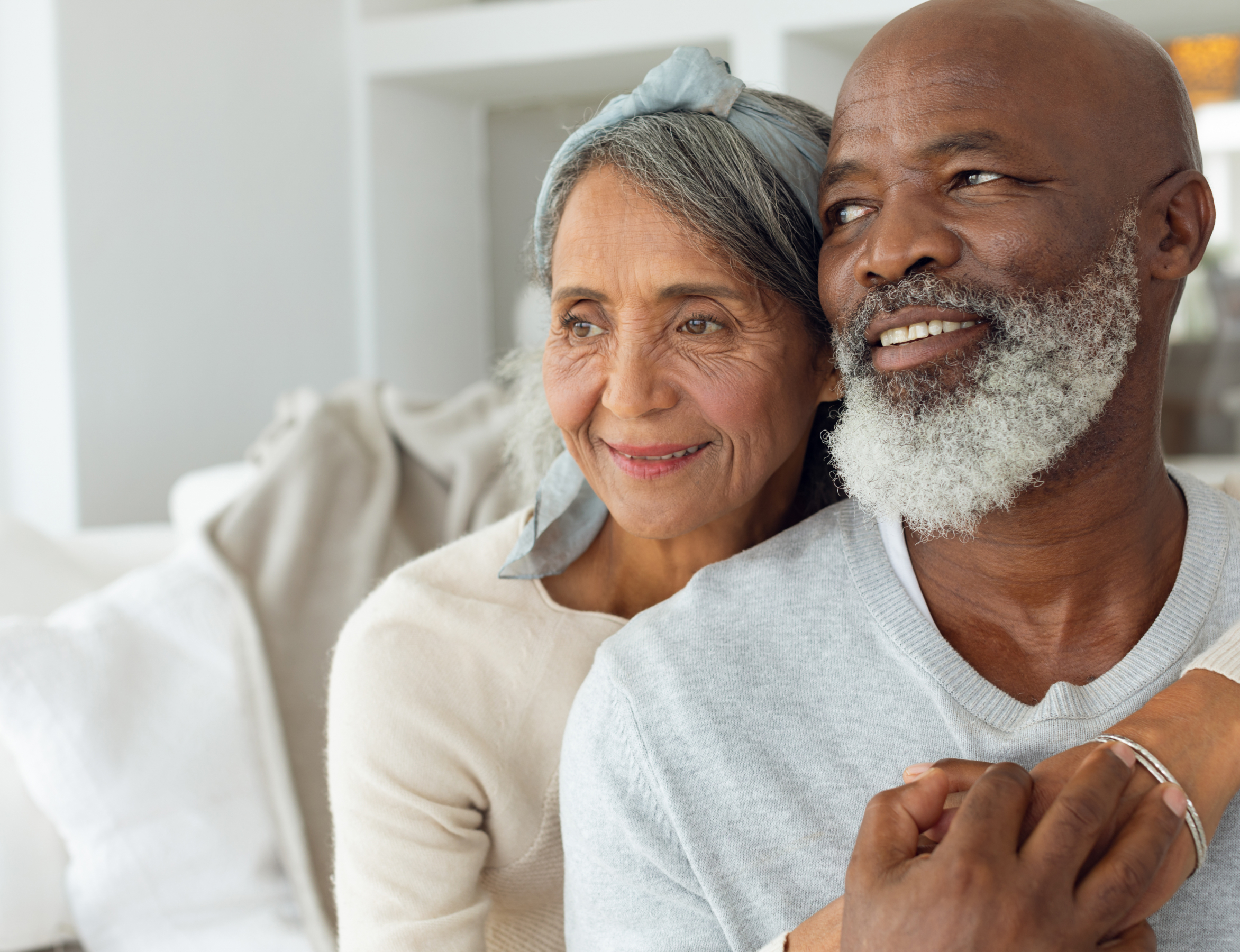 Interracial couple on couch - facing left