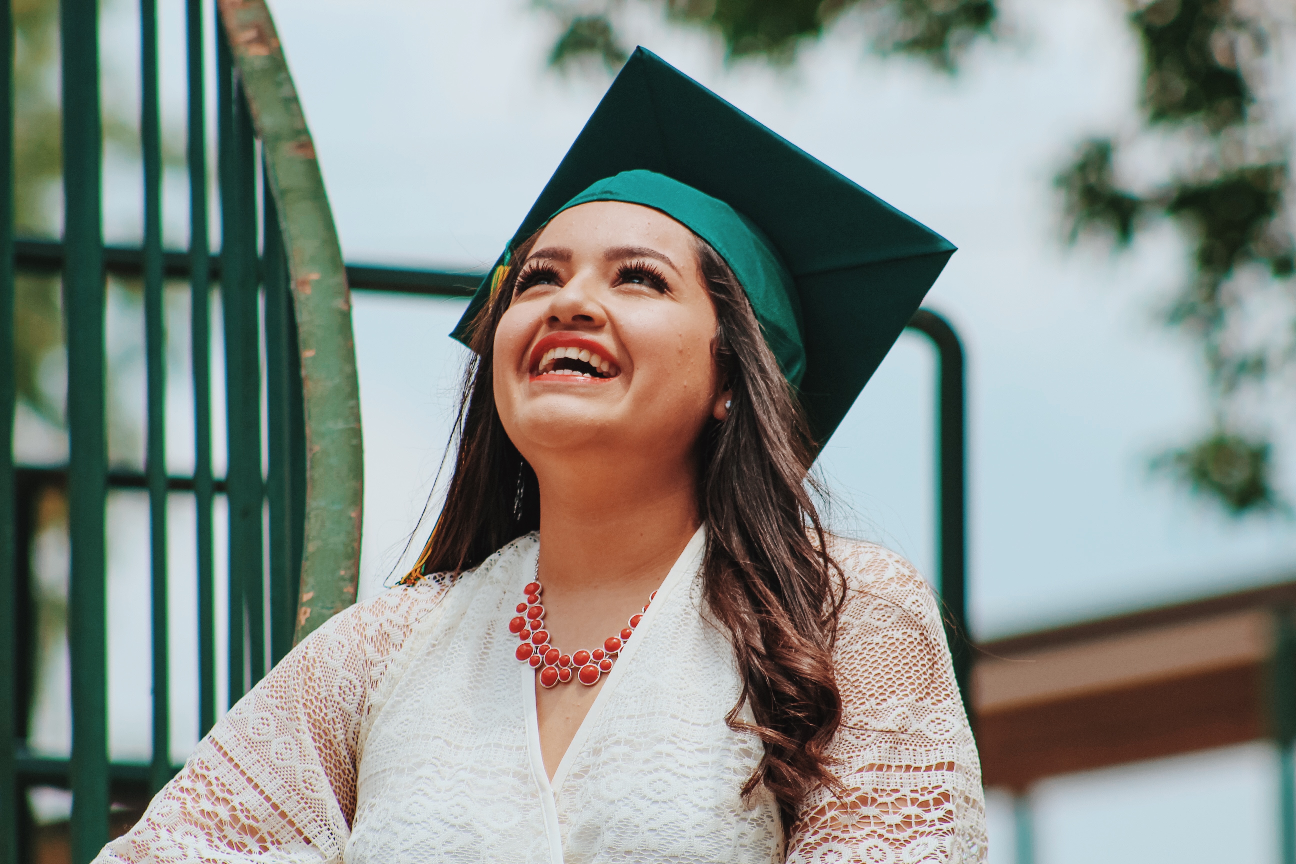 Smiling international students graduate