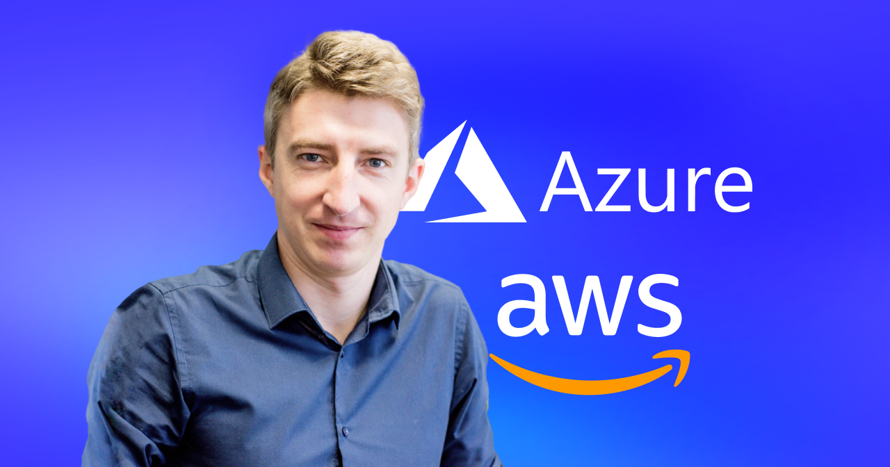 A picture of an expert in a formal dark blue shirt, on a blue backgroud.