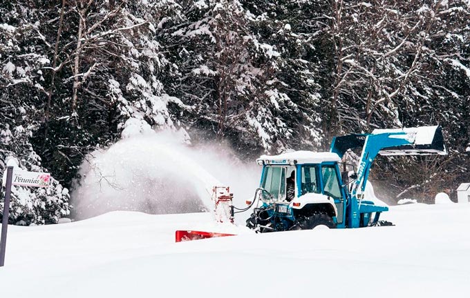 Snow plow tractor in Wisconsin