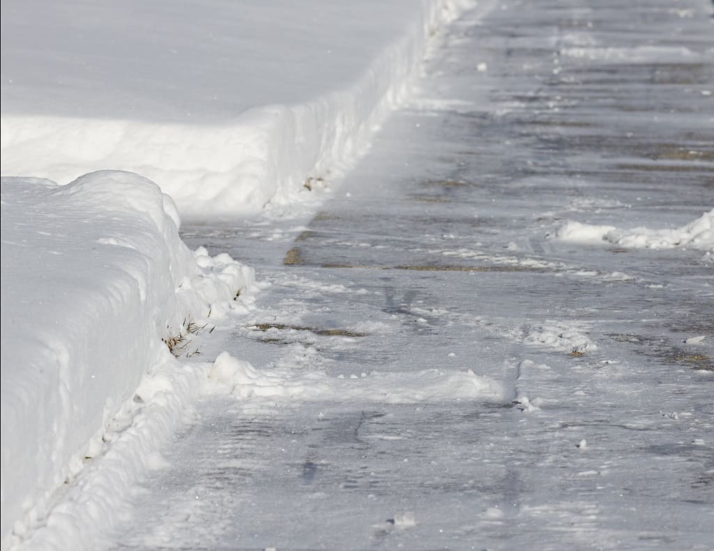 Salting Sidewalk in Winter