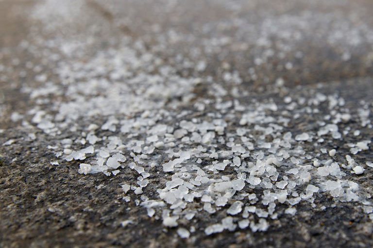 How does salt work to melt ice