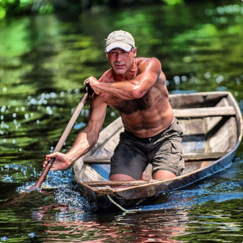 Mike Horn on a boat in Amazonia