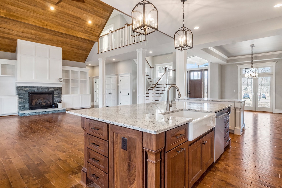 large open floor plan with fireplace aiming towards kitchen
