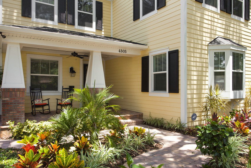 large yellow home exterior