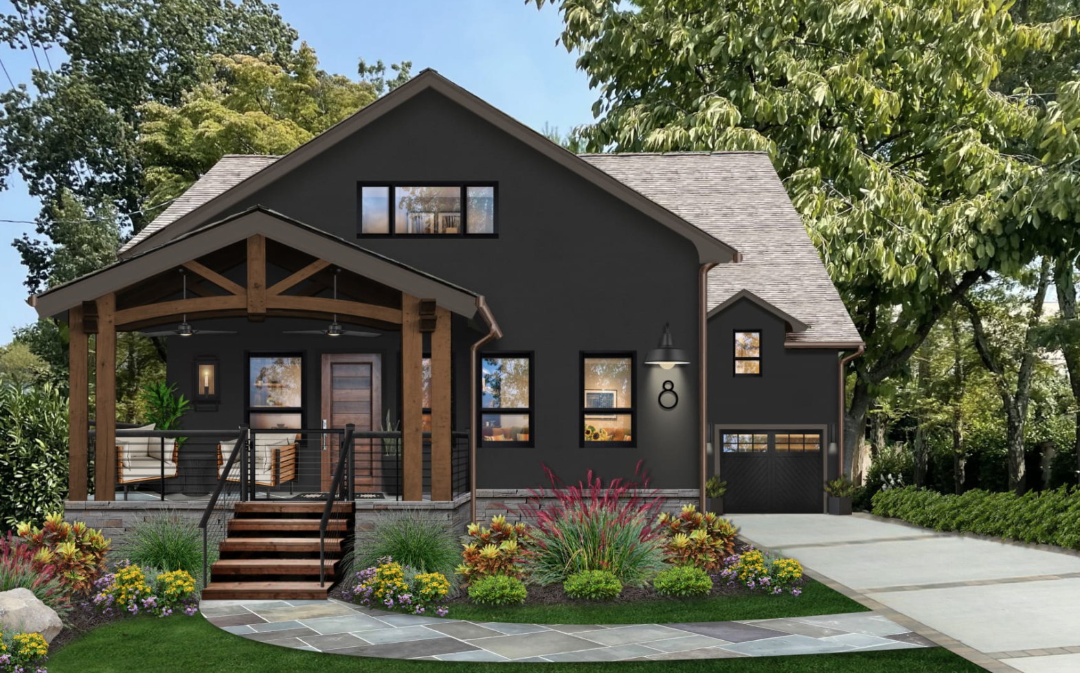A exterior shot of a home surrounded by trees painted in Sherwin Williams’ Caviar