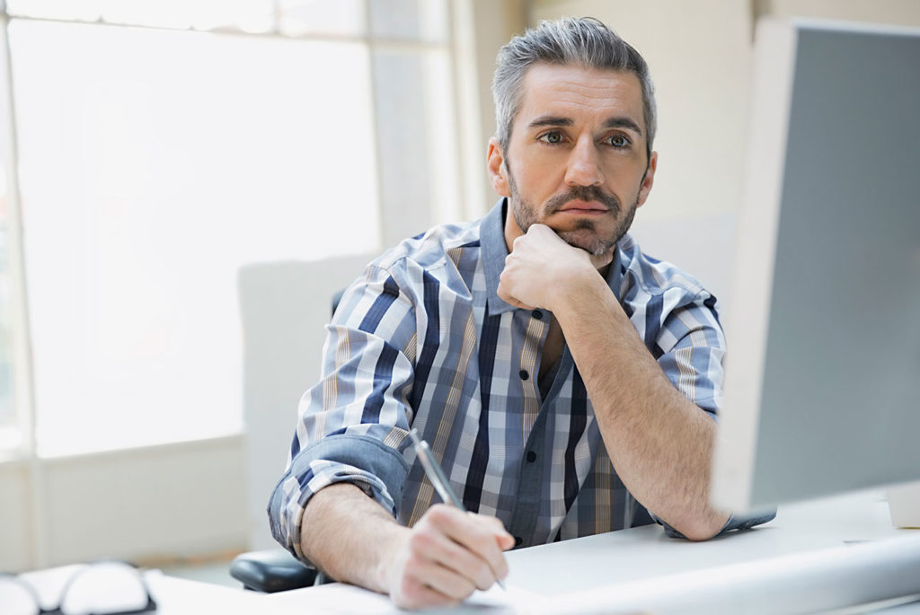 businessman thinking about Canadian self-employement tax rate