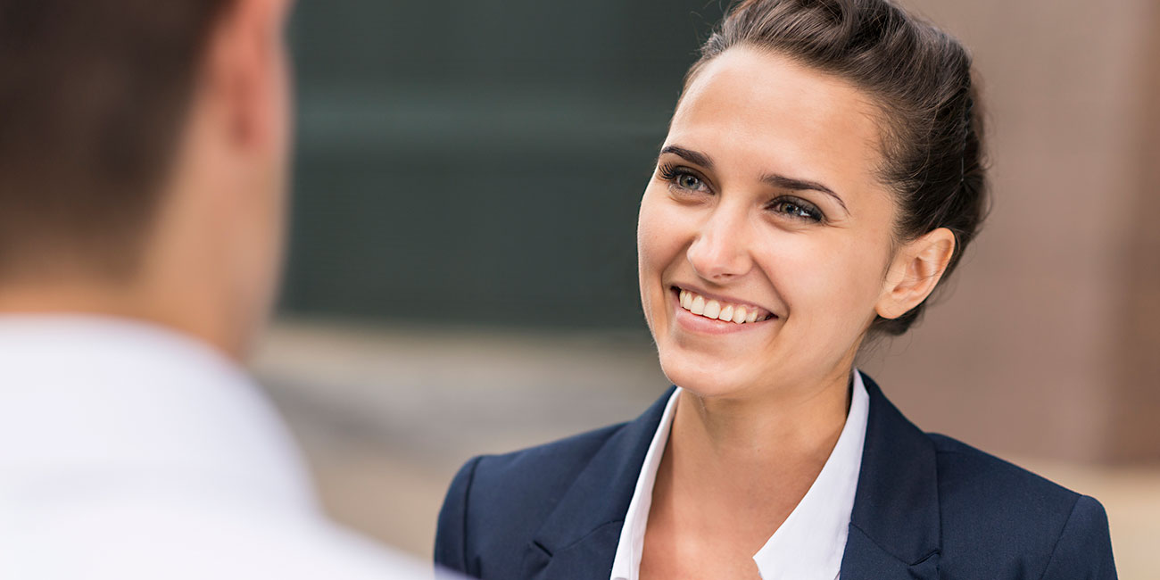 smiling successful businesswoman looking upwards