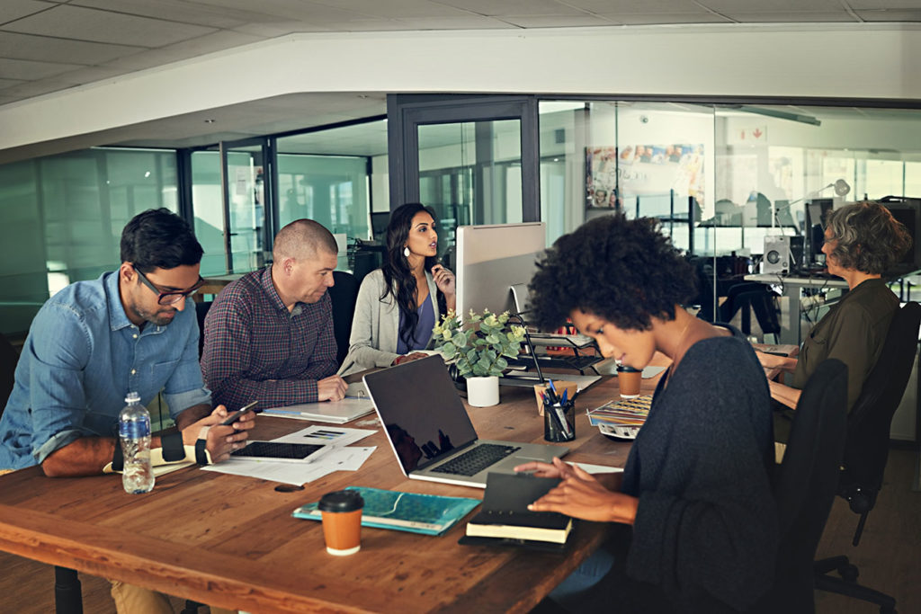 a group of business people in a workspace designed to fuel collaboration