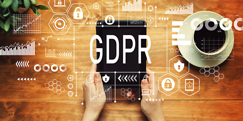 GDPR concept overlay on photo with a person holding a tablet