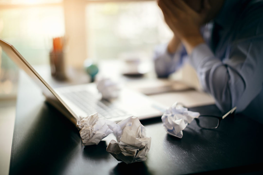 Stressed businessman working late in office