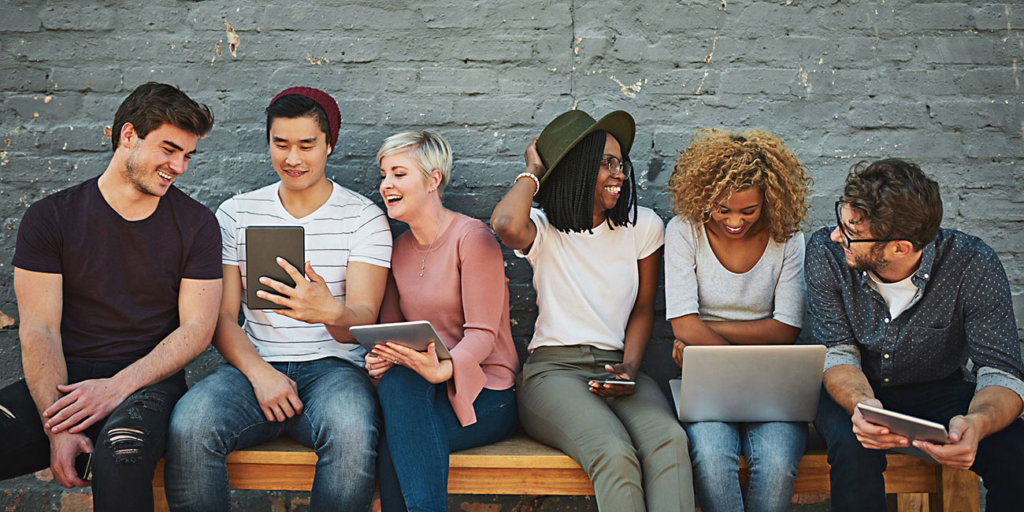 Shot of a diverse group of people social networking outside
